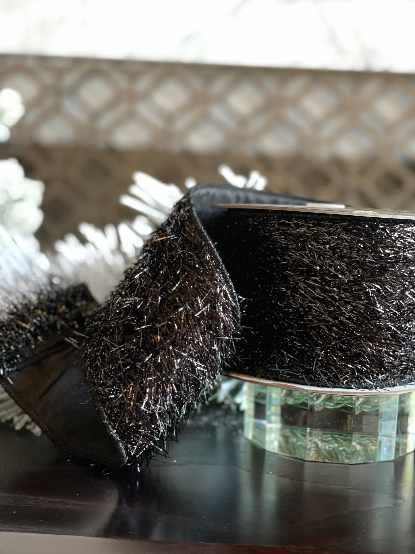 4"x5 yards tinsel ribbon black. Wired.