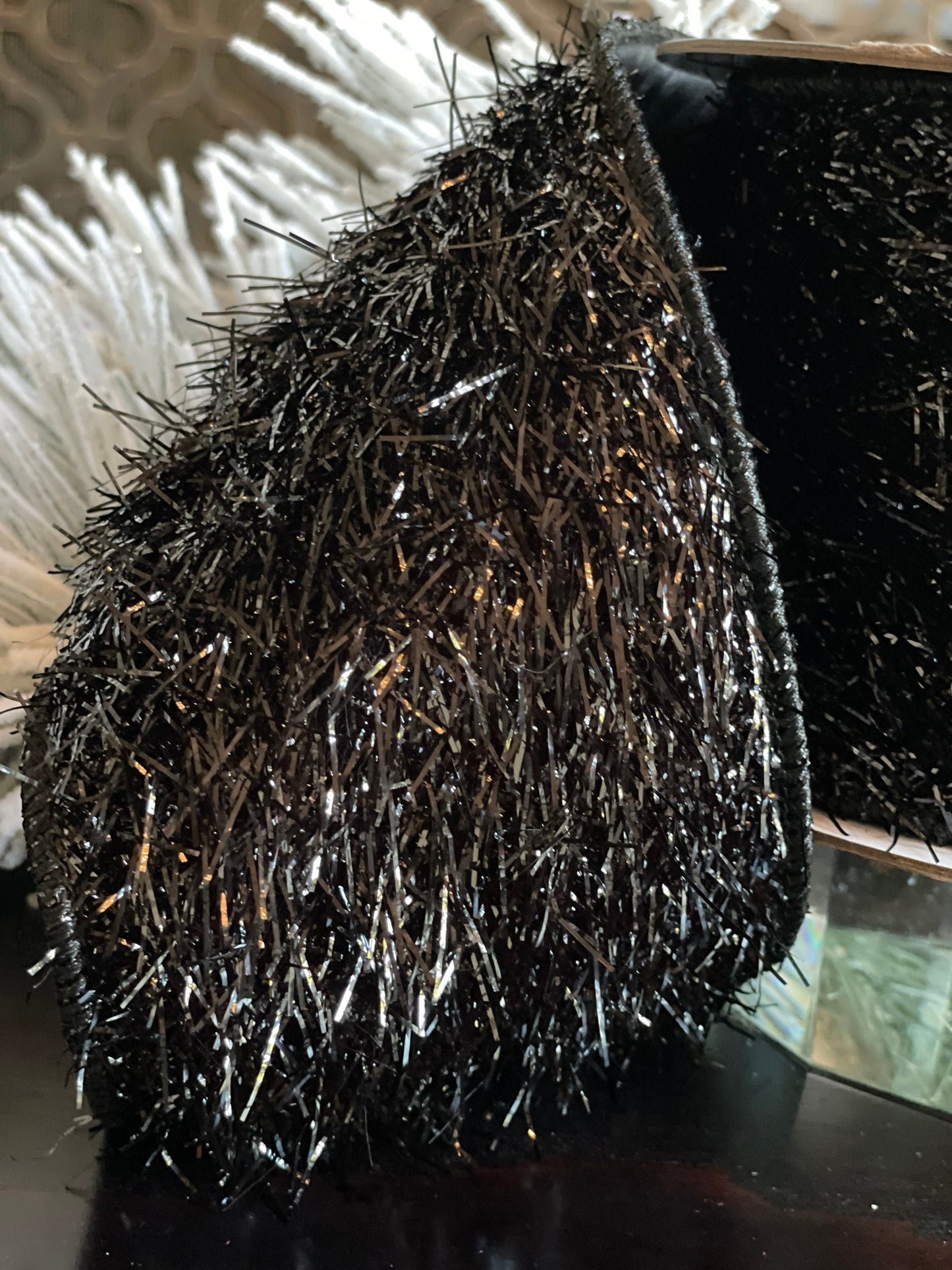 4"x5 yards tinsel ribbon black. Wired.
