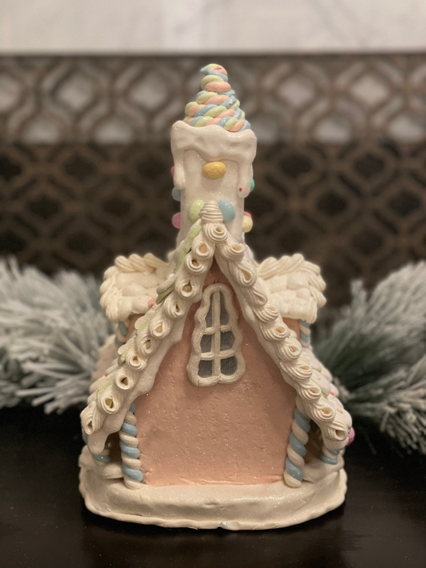 10”L x 13”H x 8.5 W Candy frosted house with snowman. Lighted. Pastel colors.