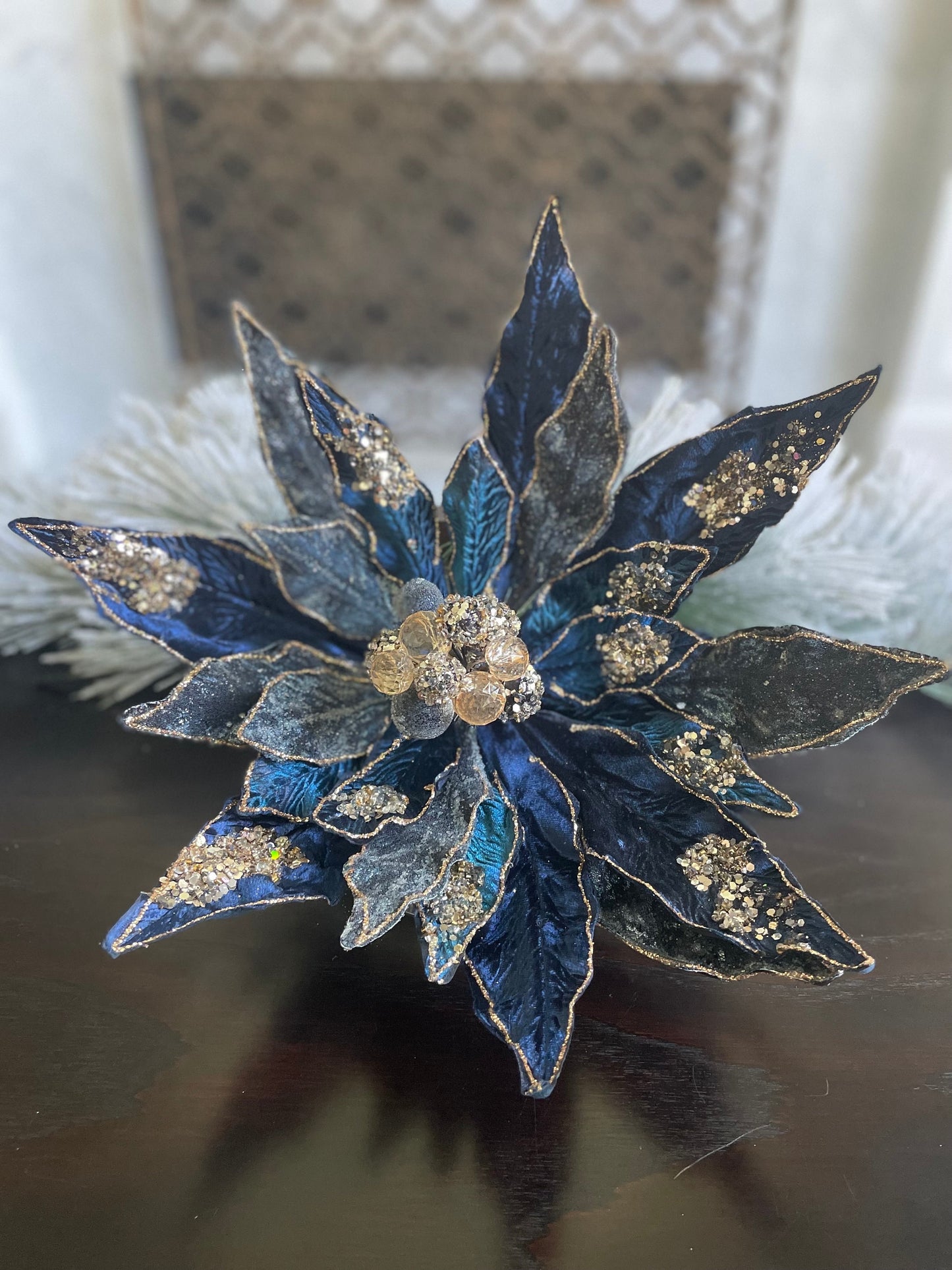 17.5” Poinsettia clip sapphire rose gold. Beaded and glitter. 17.5” tip to tip.