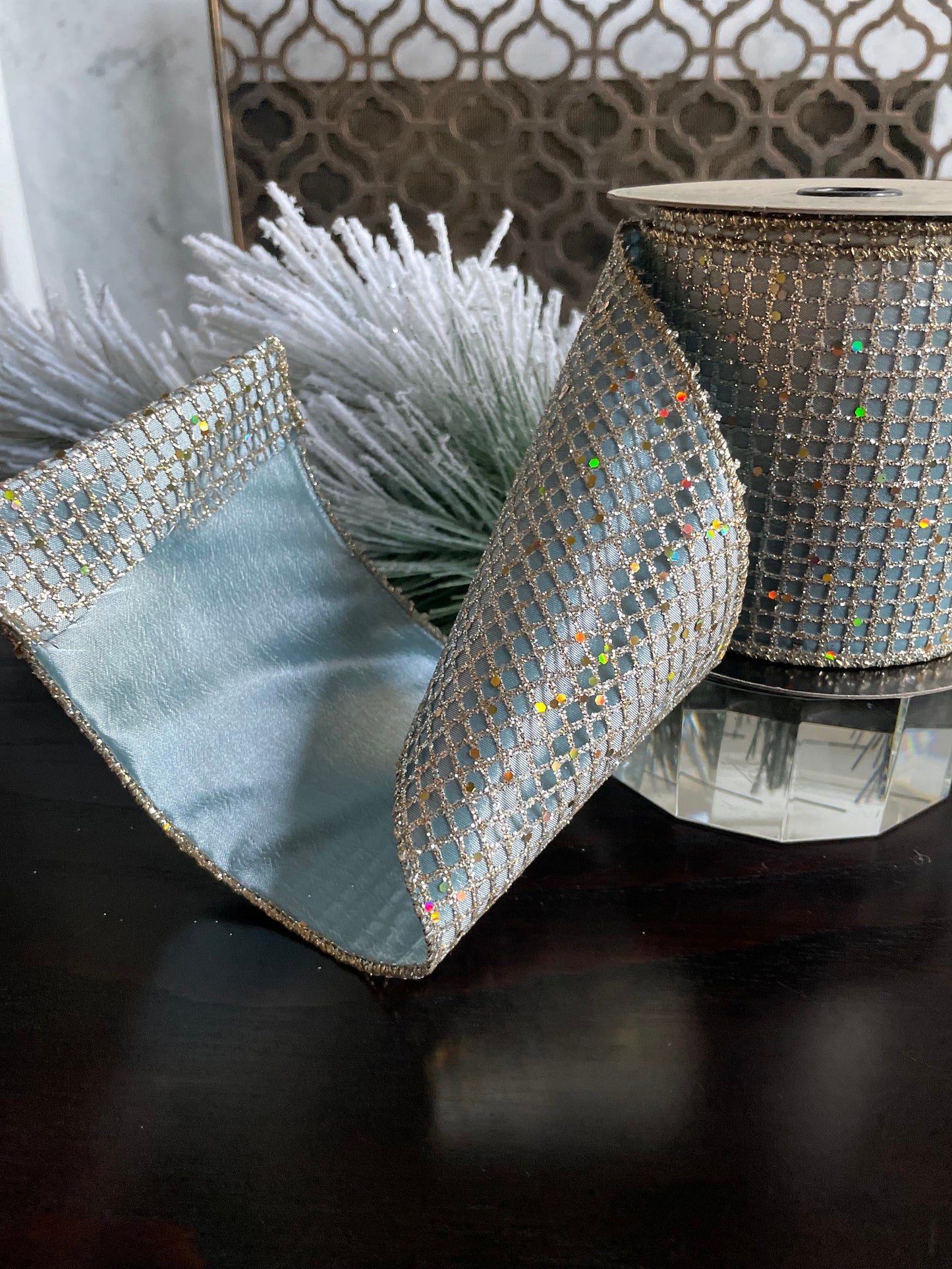 4” x 10 yds. Designer taffeta glitter mesh platinum-blue ribbon. Wired. D. Stevens.