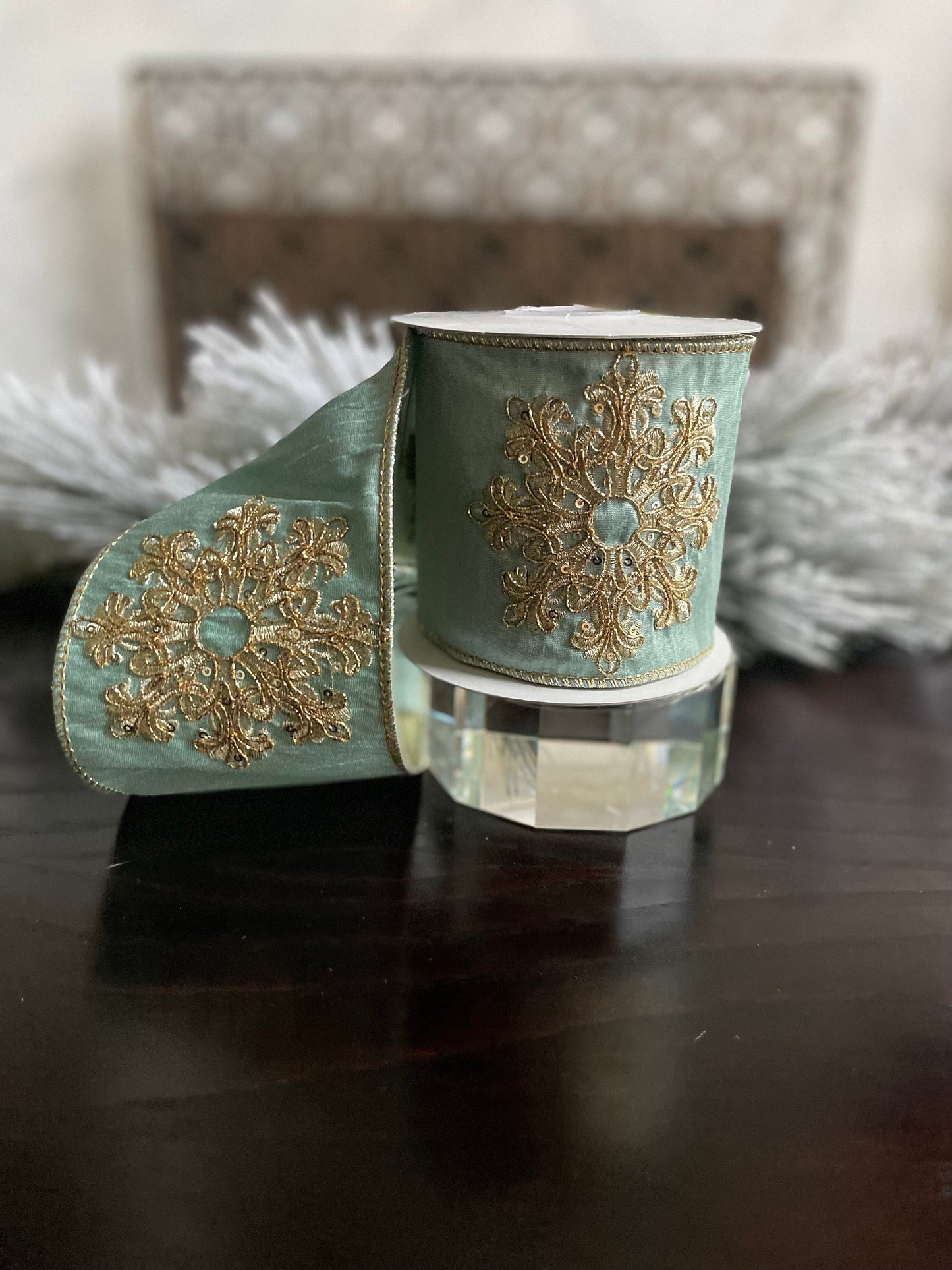 4” x 5 yds. Designer aqua and gold snowflake embroided dupion ribbon. Wired. Regency.