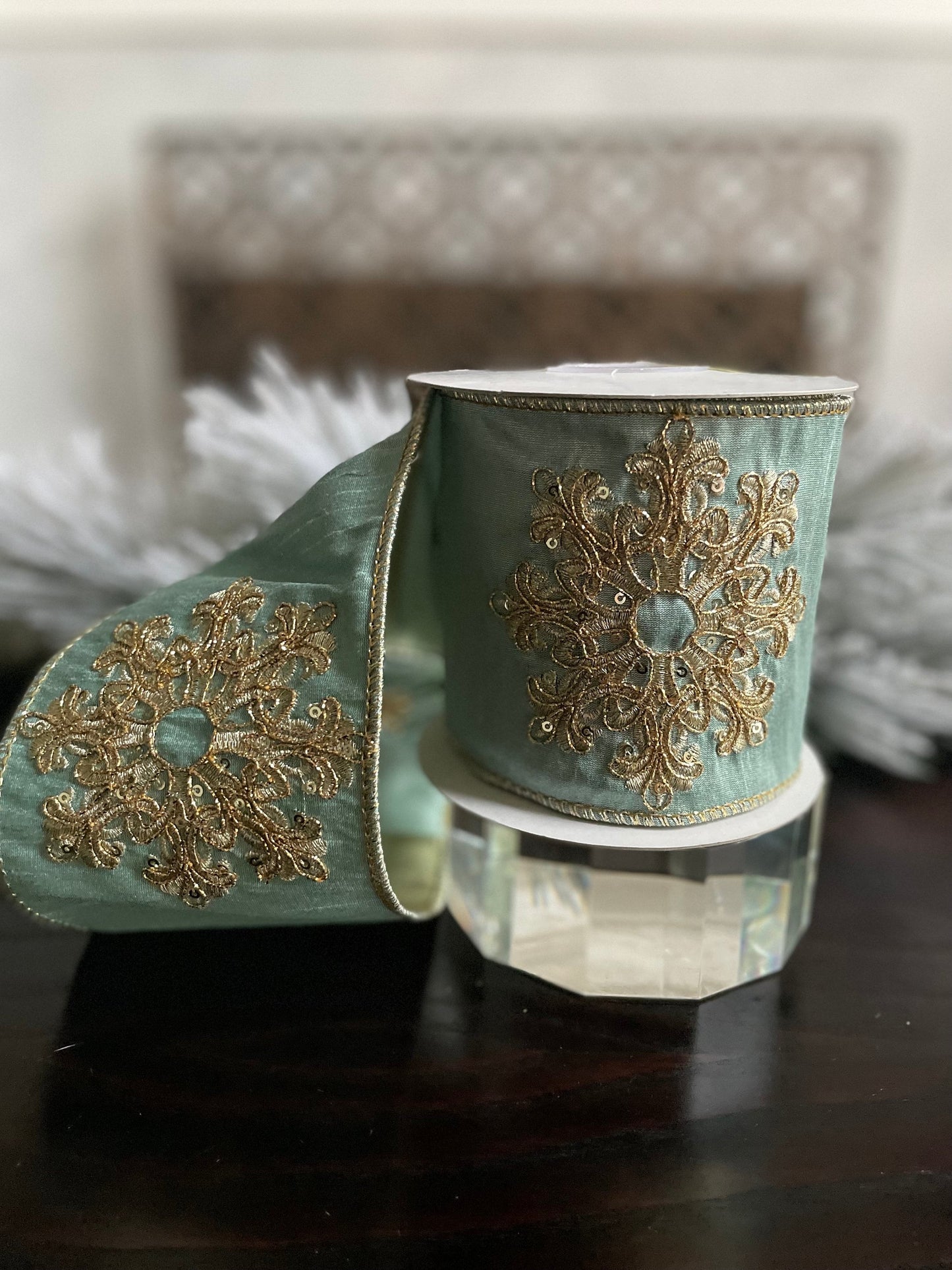 4” x 5 yds. Designer aqua and gold snowflake embroided dupion ribbon. Wired. Regency.