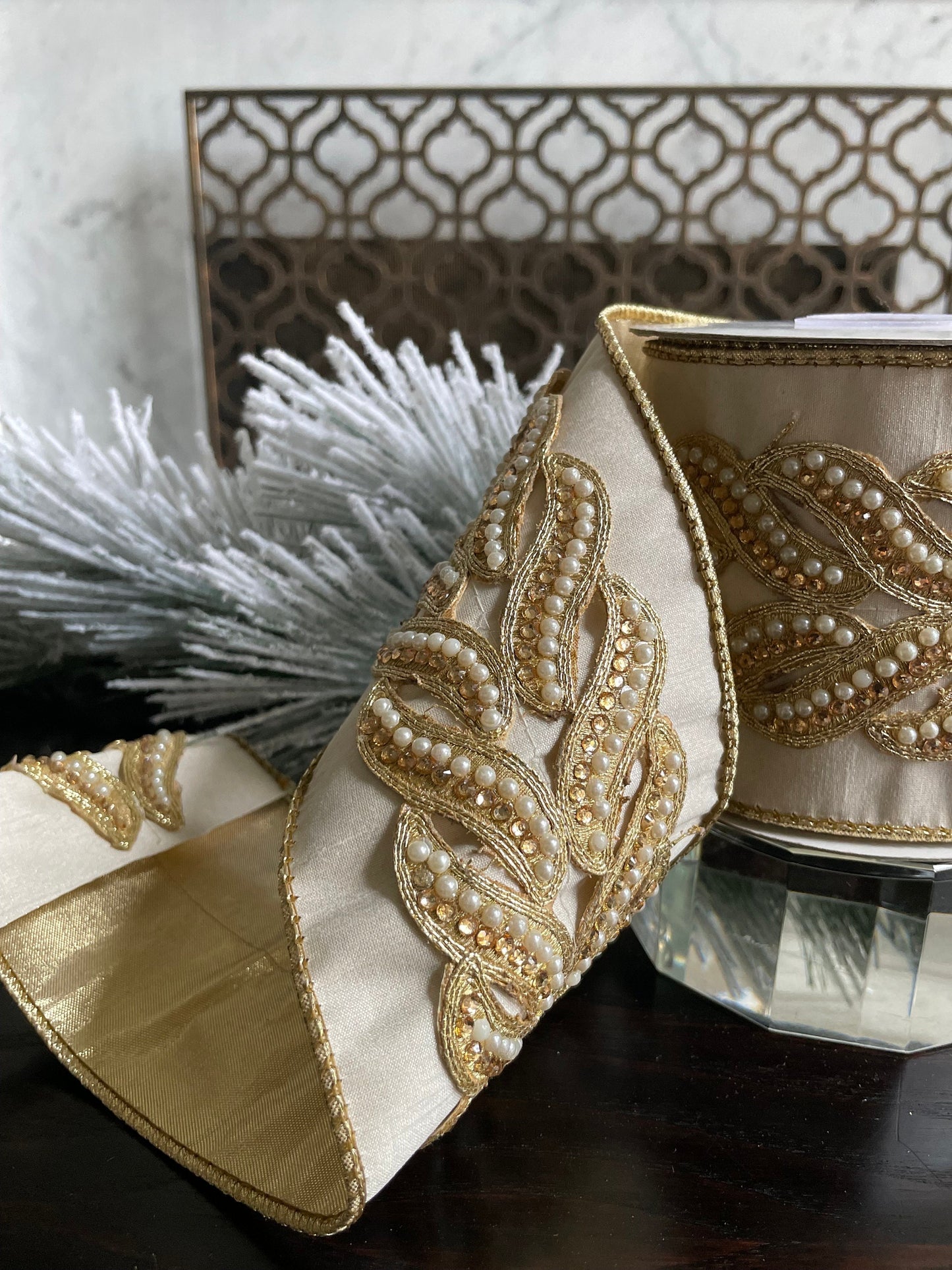 4” x 5 yds. Designer ivory and gold pearl and jewel trim dupion gold back ribbon. Wired. Regency.
