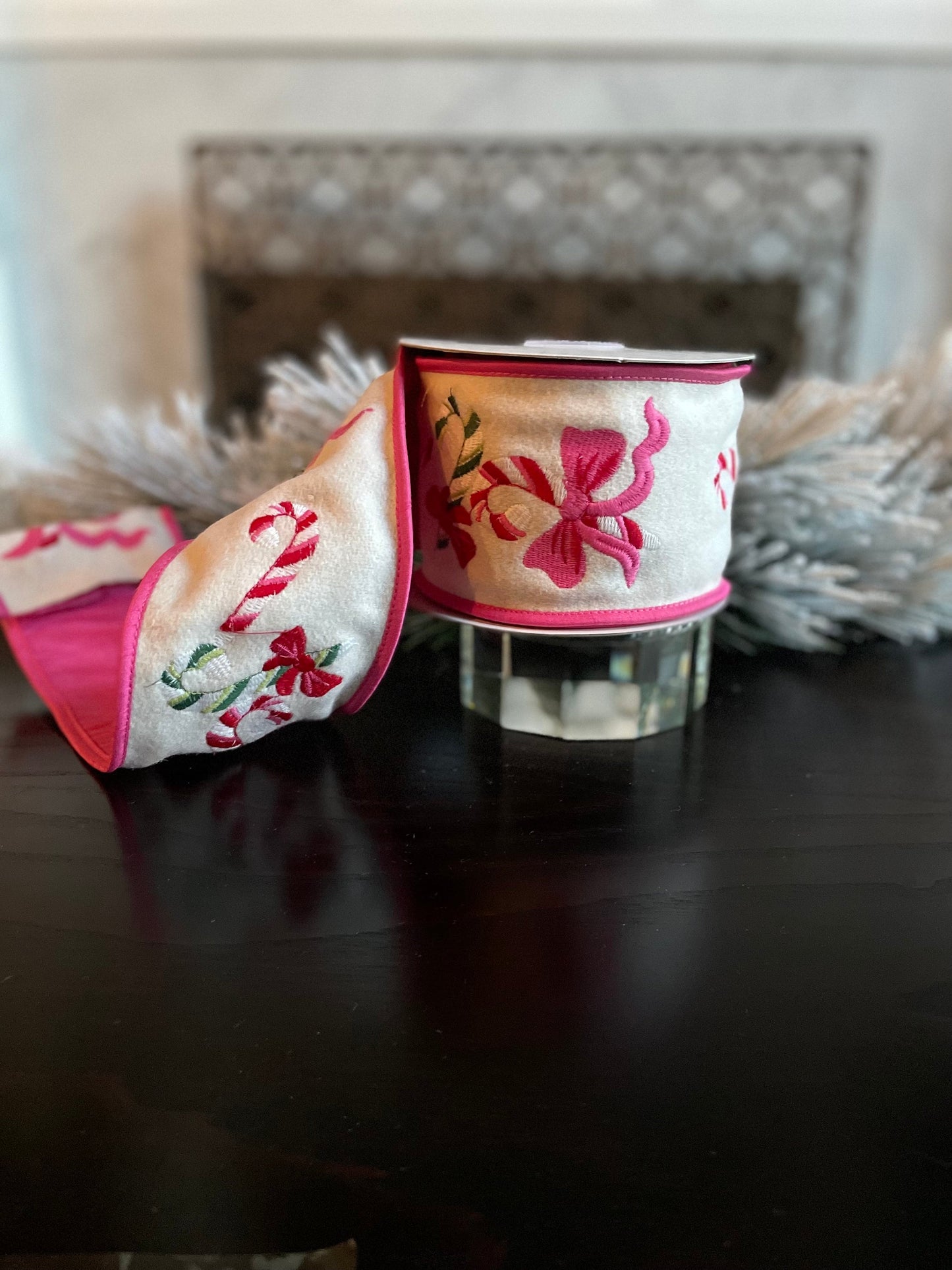 4” x 5 yds. Designer candy cane and bow embroidered wool felt ribbon. Pink and cream. Wired. Regency.