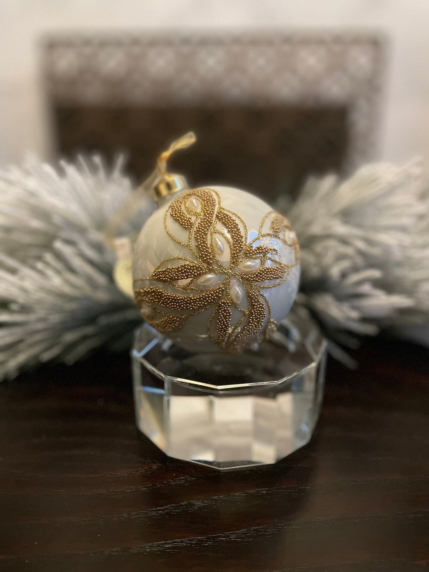 Set of 2. 4" glass ivory and gold embellished with pearls ornament ball.