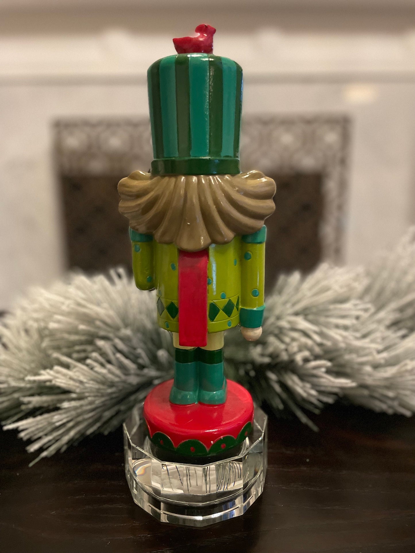 Nutcracker. 12” resin nutcracker with packages. Multi color.