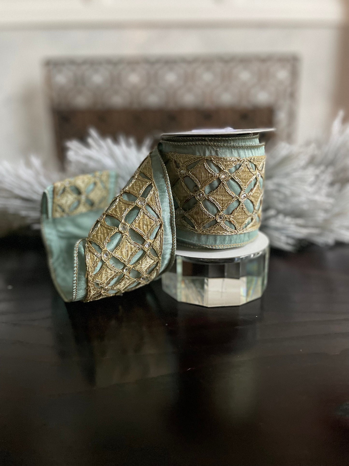4” x 5 yds. Designer aqua and platinum jeweled diamond dupion ribbon. Aqua and platinum ribbon. Wired. Regency.