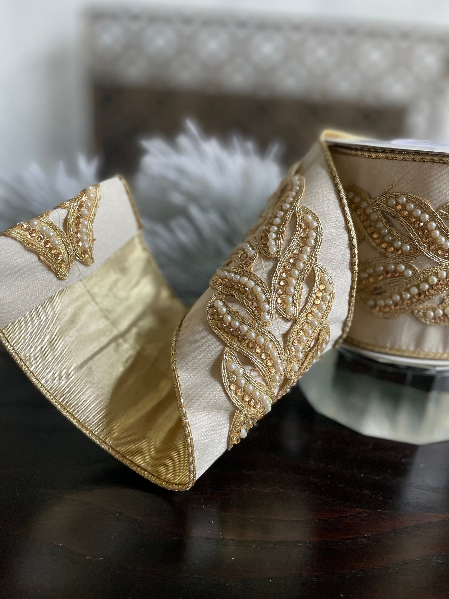 4” x 5 yds. Designer ivory and gold pearl and jewel trim dupion gold back ribbon. Wired. Regency.