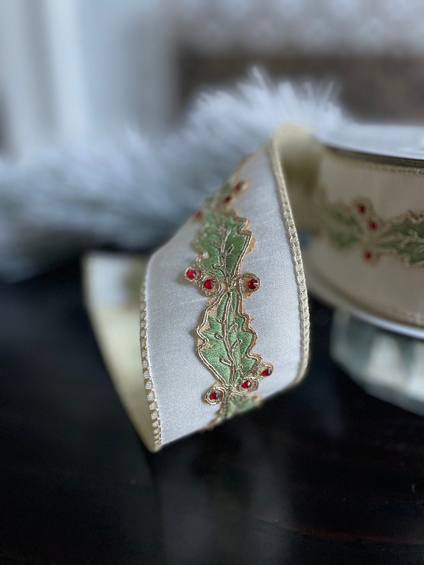 2.5” x 10 yds. Designer holly leaf wired ribbon. Raz.
