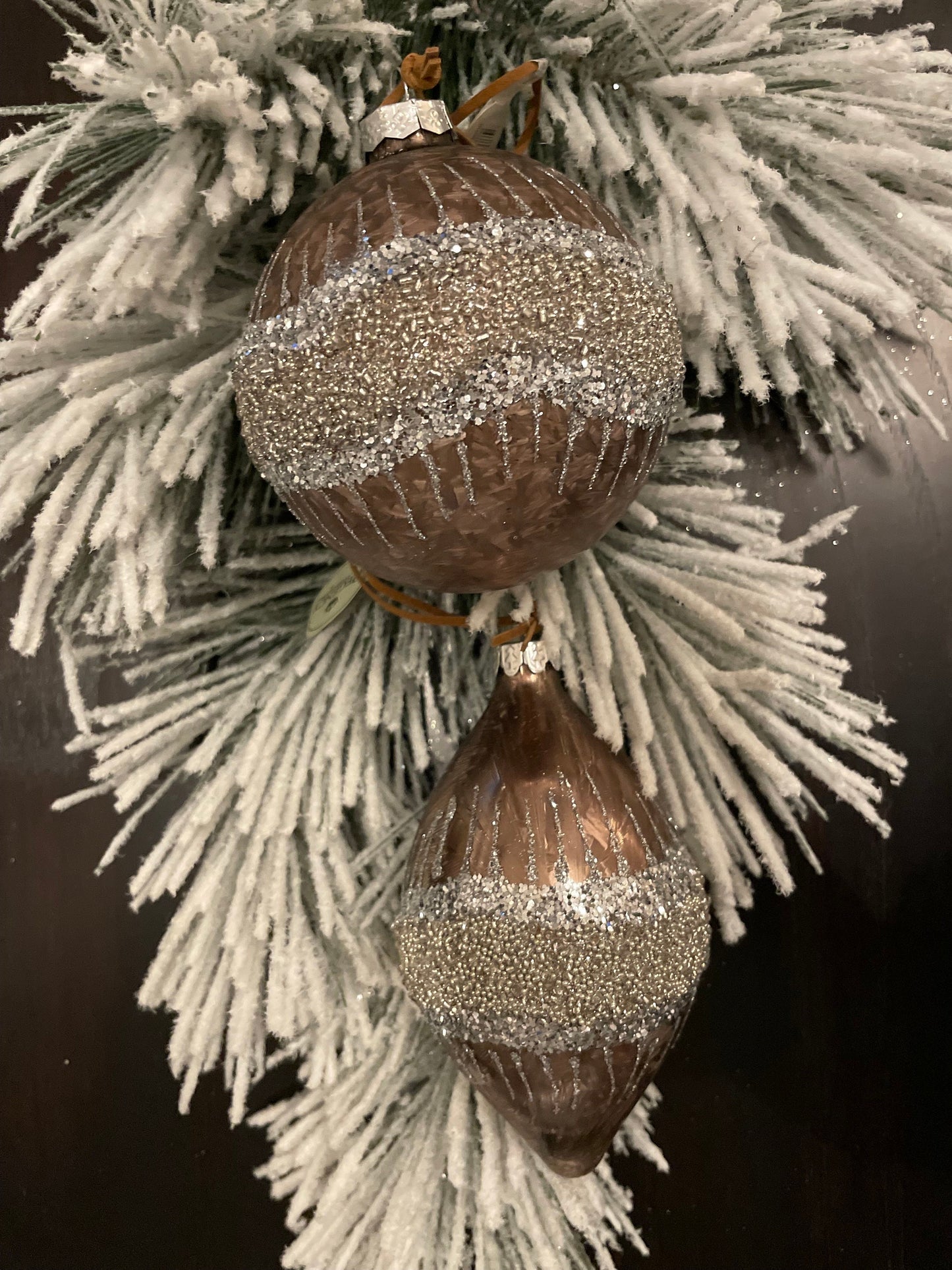 Set of 2. 4”-6” Glass frosted glitter wave ball and kismet.