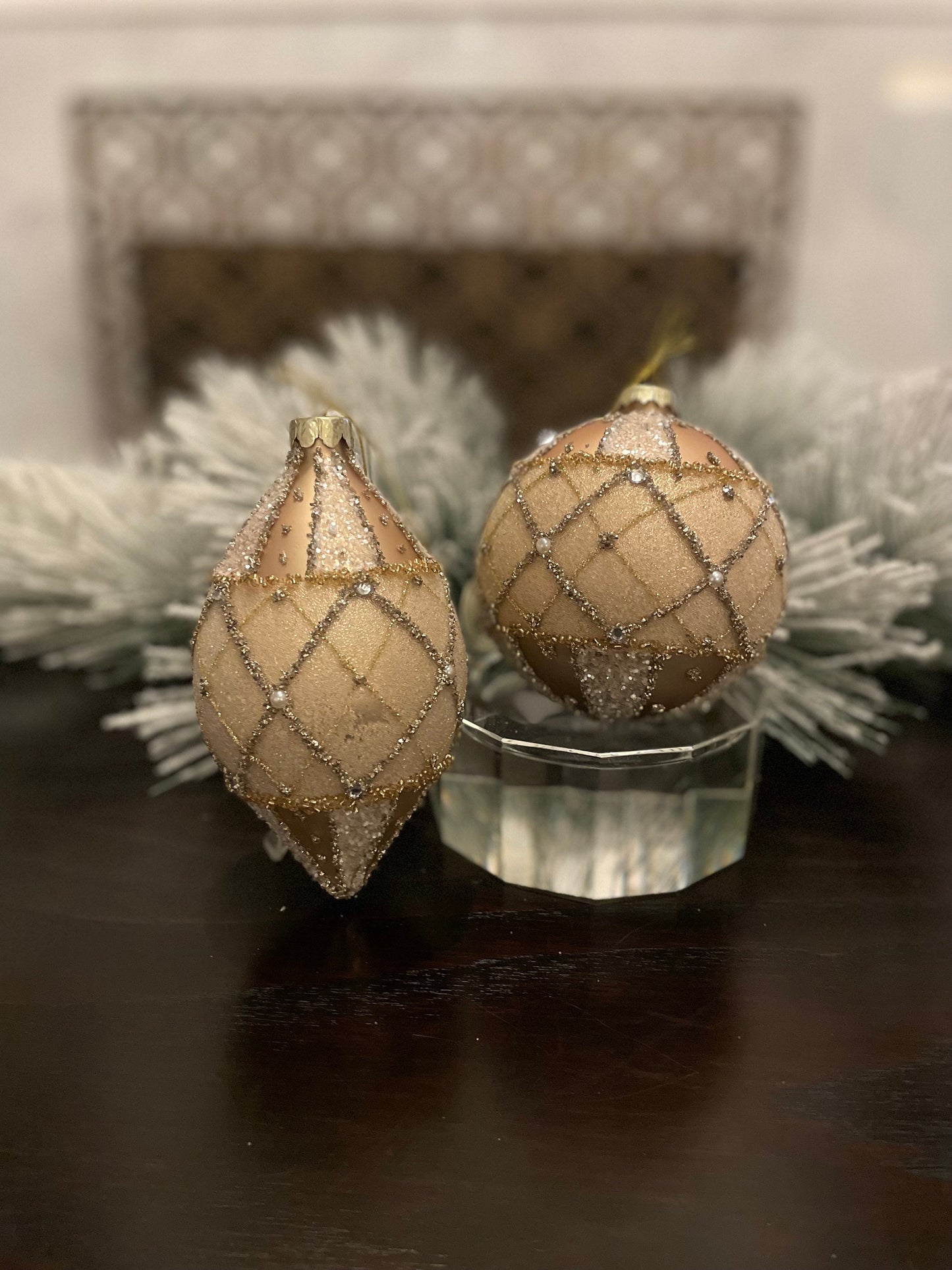 Set of 2. 4-6” glass jewel edge ball and finial ornaments. Ivory and gold.