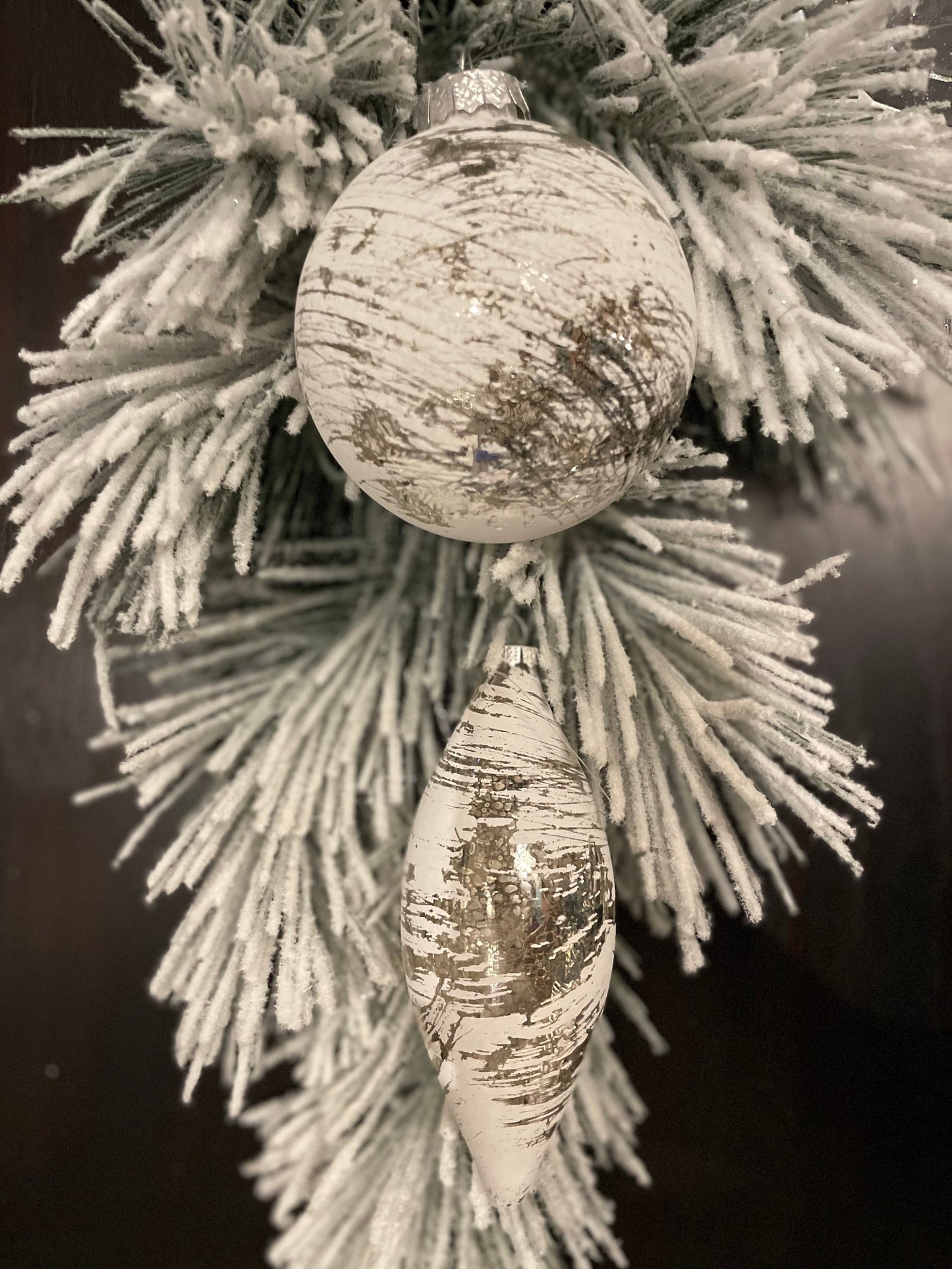 Set of 2. 4”-6” glass whitewash mercury ball and finial.