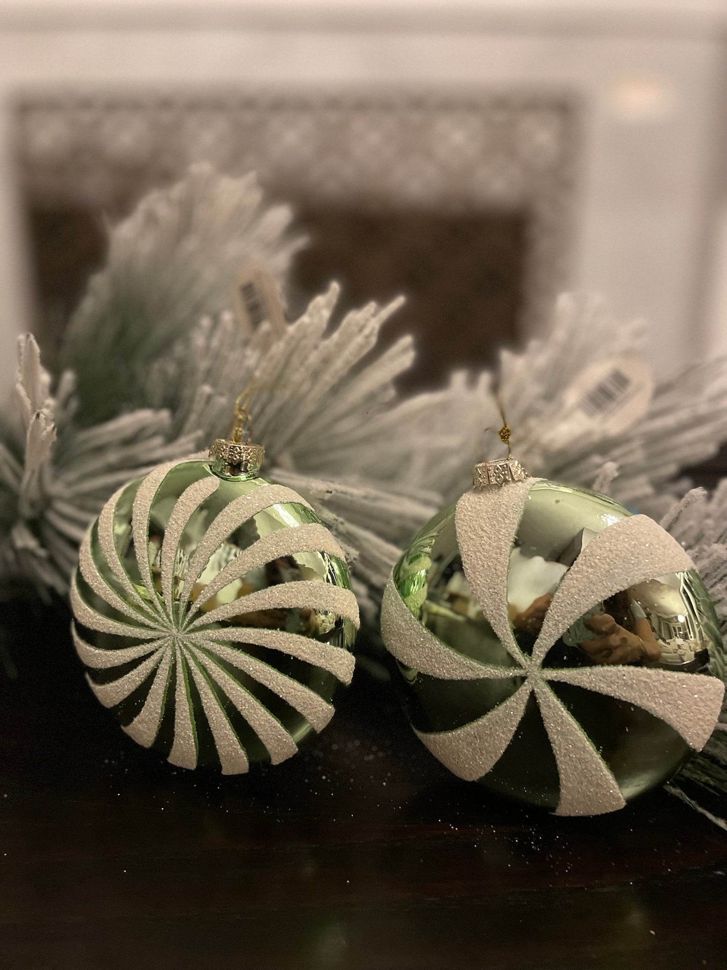 Set of 2. 4" glass peppermint candy disk ornament. Green and white.