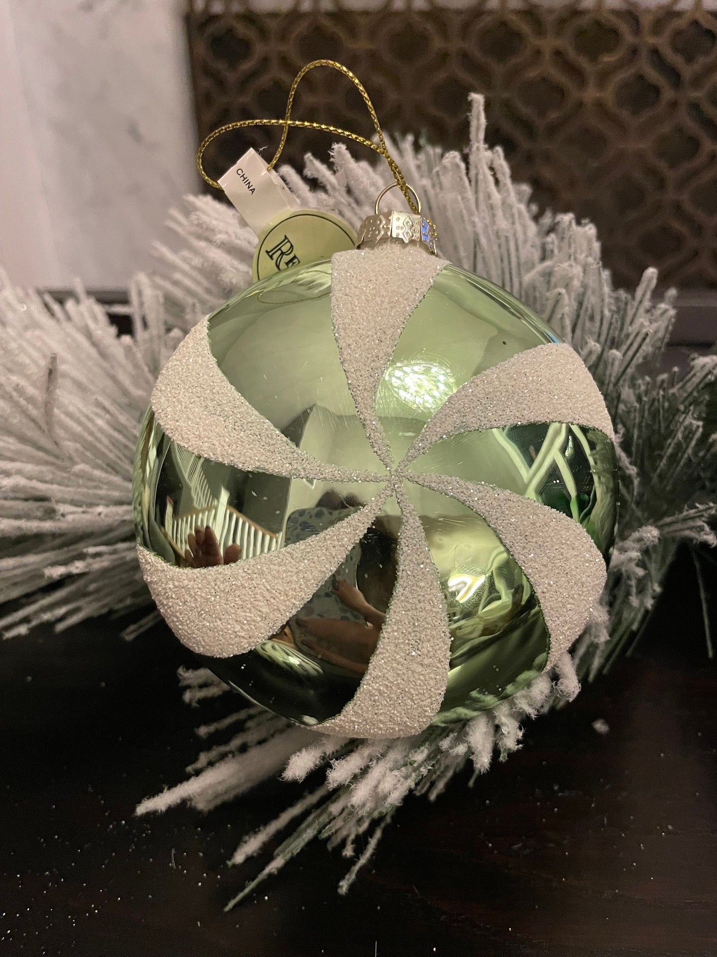 Set of 2. 4" glass peppermint candy disk ornament. Green and white.