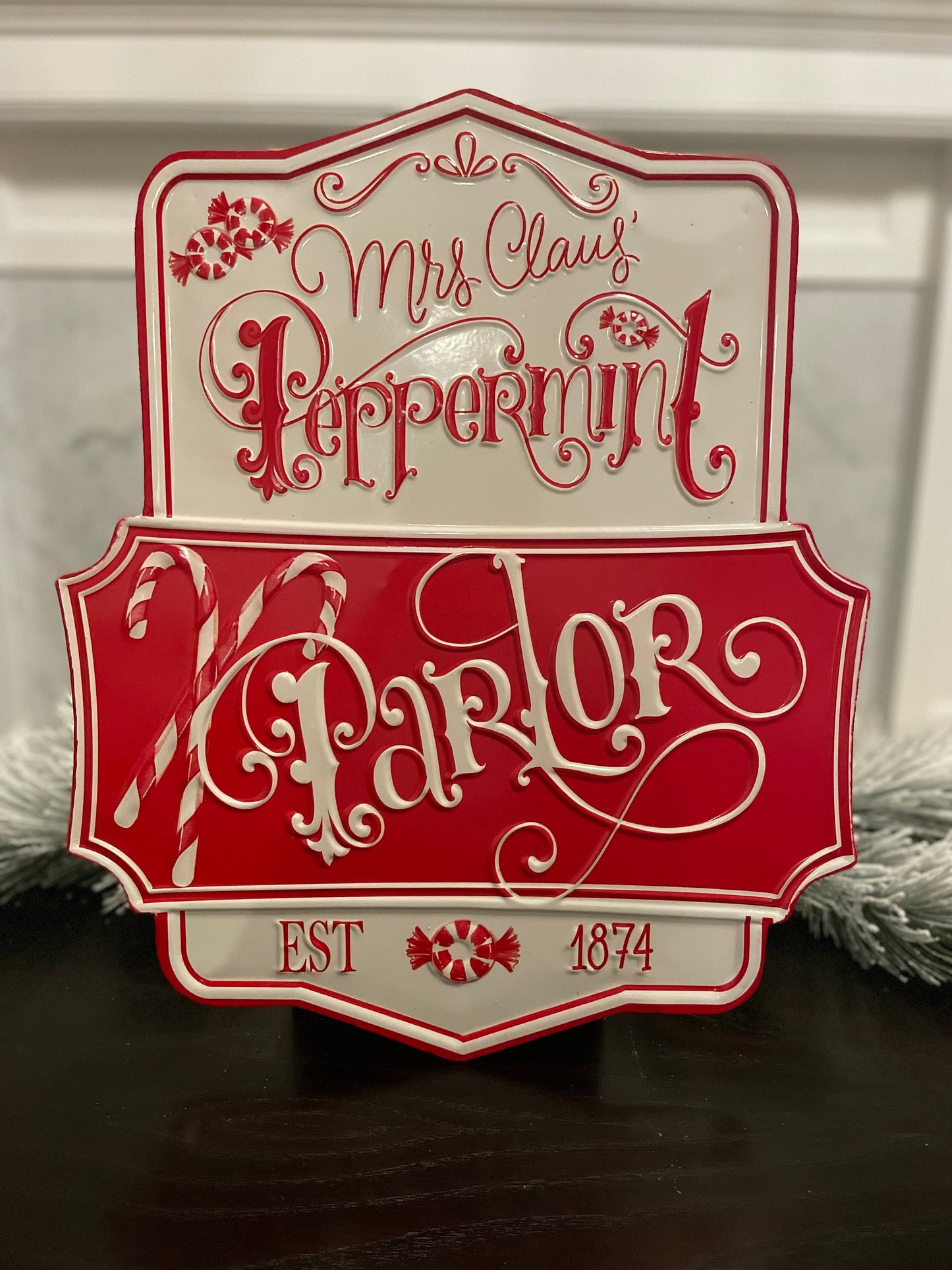 21.75” Peppermint parlor embossed metal wall art.