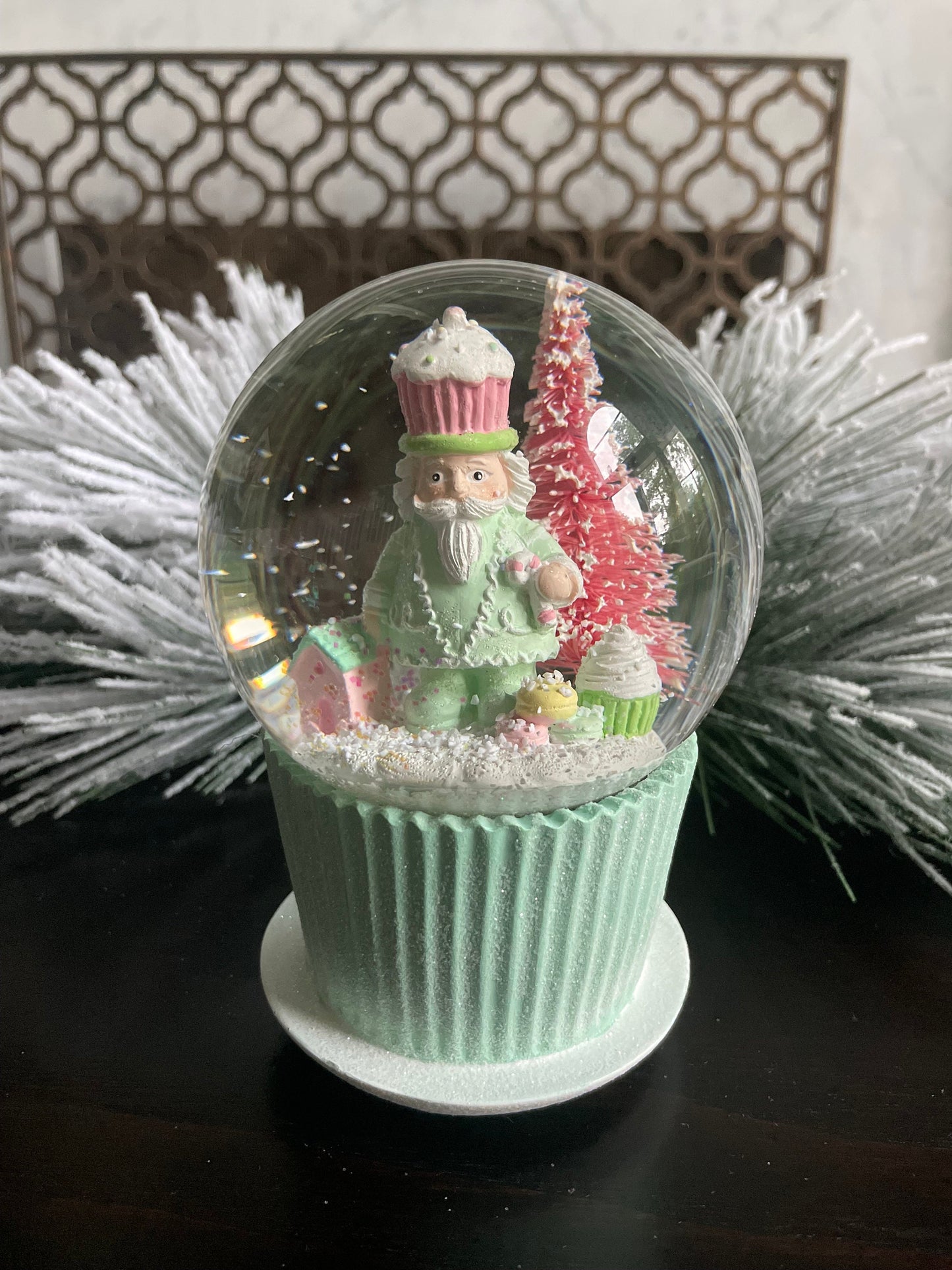 6" Cupcake and nutcracker water music globe. Pastel colors. Candy. Music jingle bells.