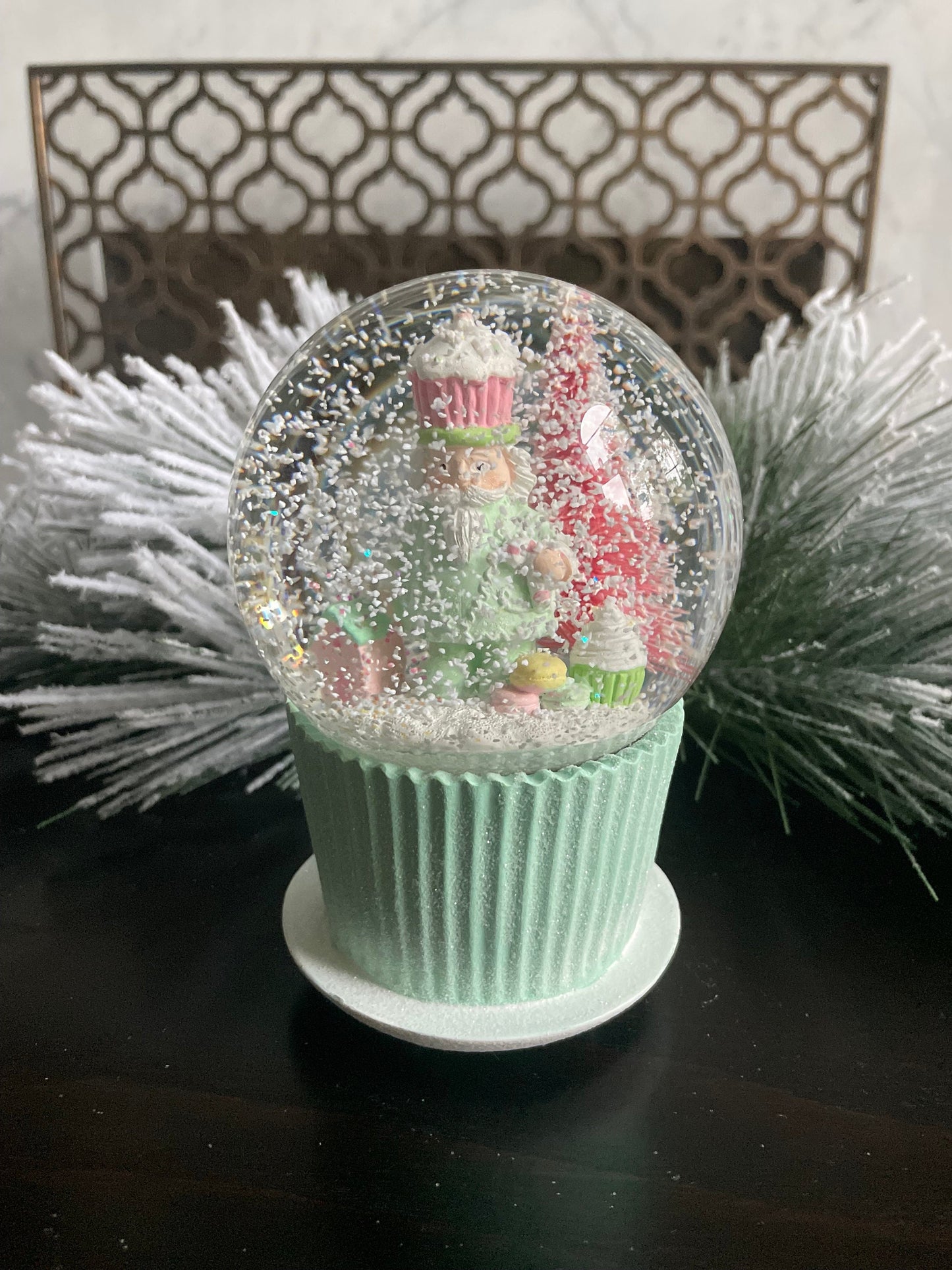 6" Cupcake and nutcracker water music globe. Pastel colors. Candy. Music jingle bells.