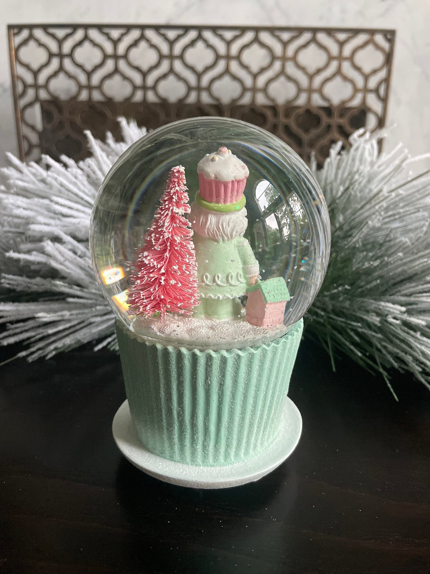6" Cupcake and nutcracker water music globe. Pastel colors. Candy. Music jingle bells.