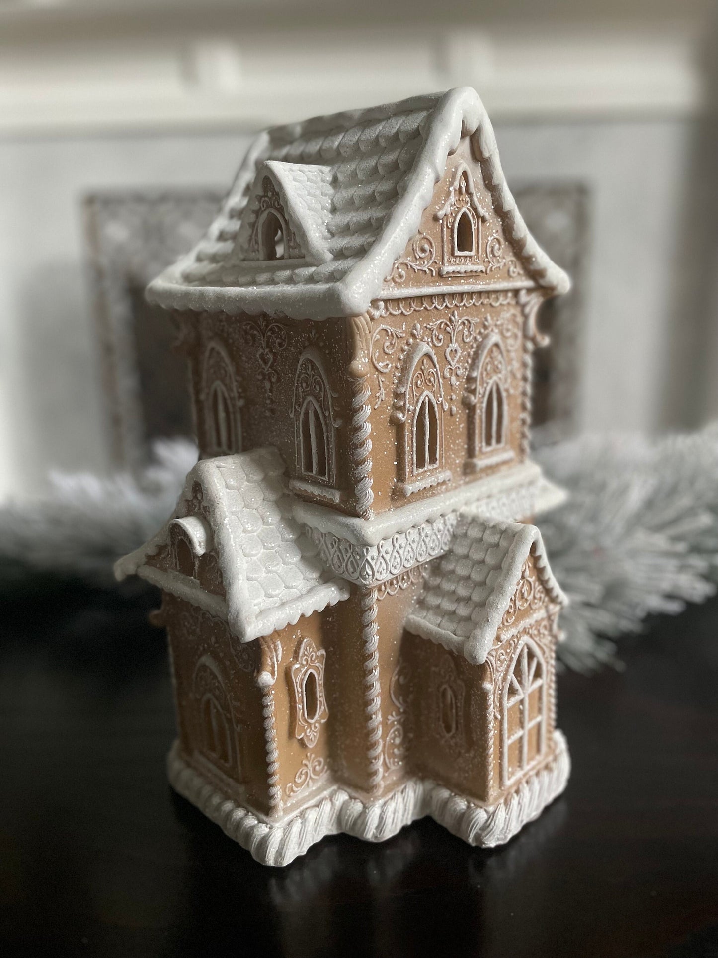 14”H X 9.5”W X 8” D. Gingerbread lighted house.