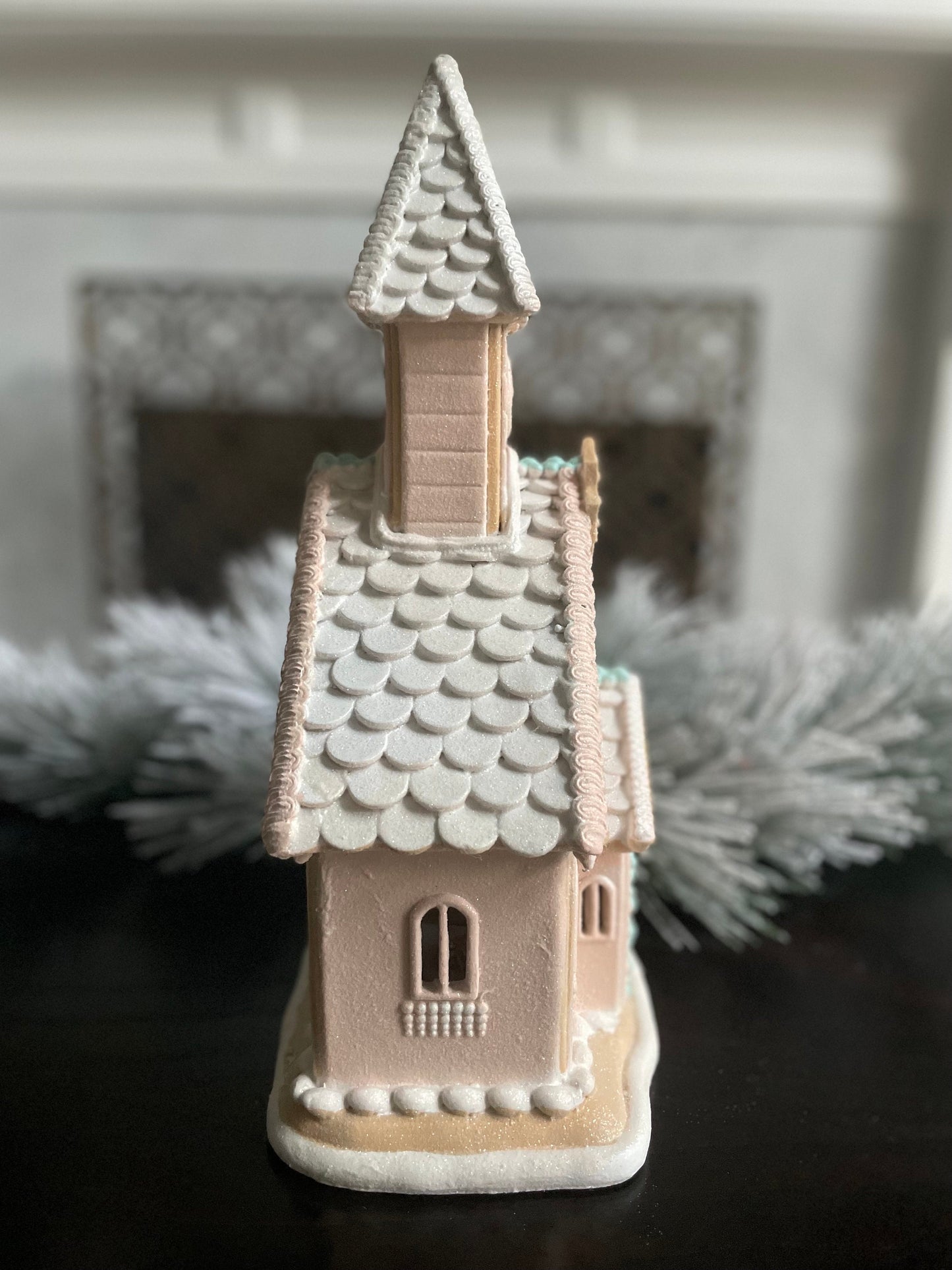 14”H x 8”W x 6” D. Gingerbread lighted church. Pink and blue.