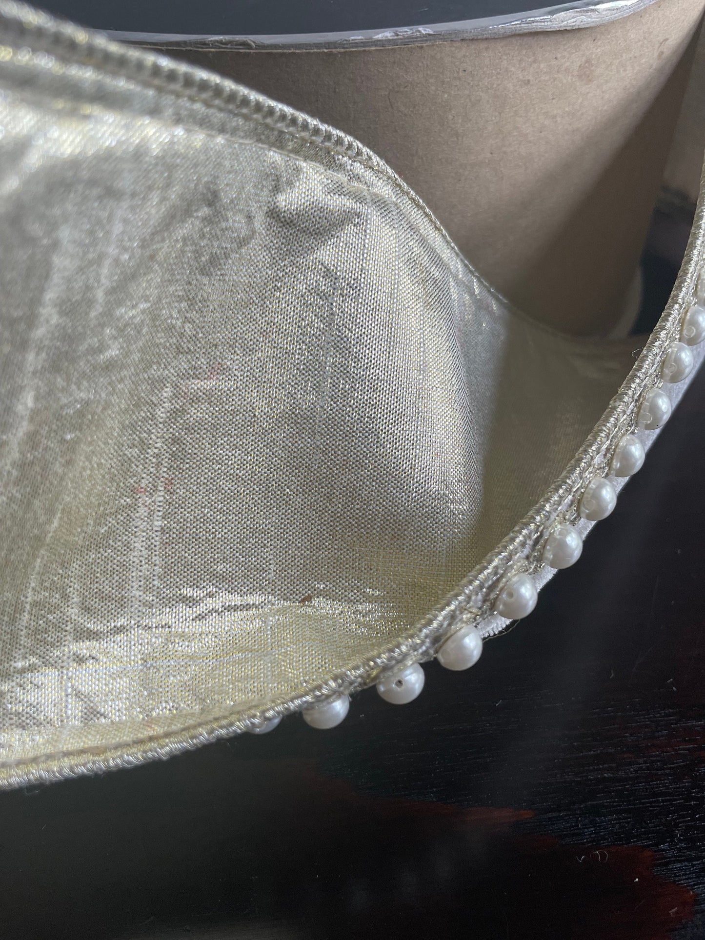 4” x 5 yds. Designer pearl borders platinum velvet wired ribbon.