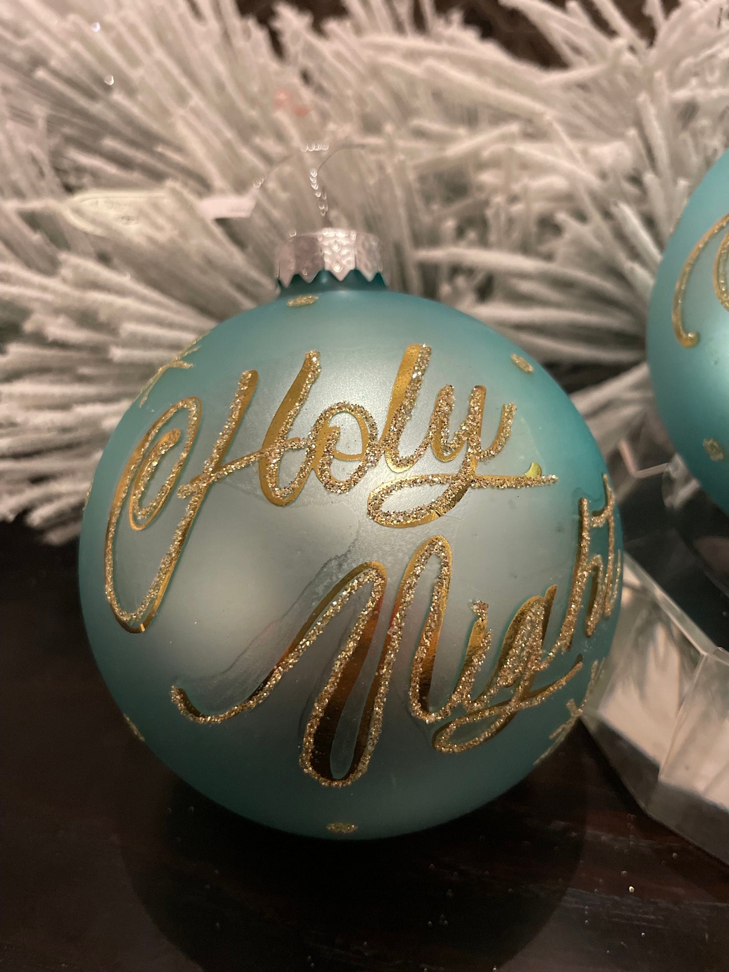 Set of 2. 4” aqua gold silent night and holly night glass ball ornaments. Set of 2.