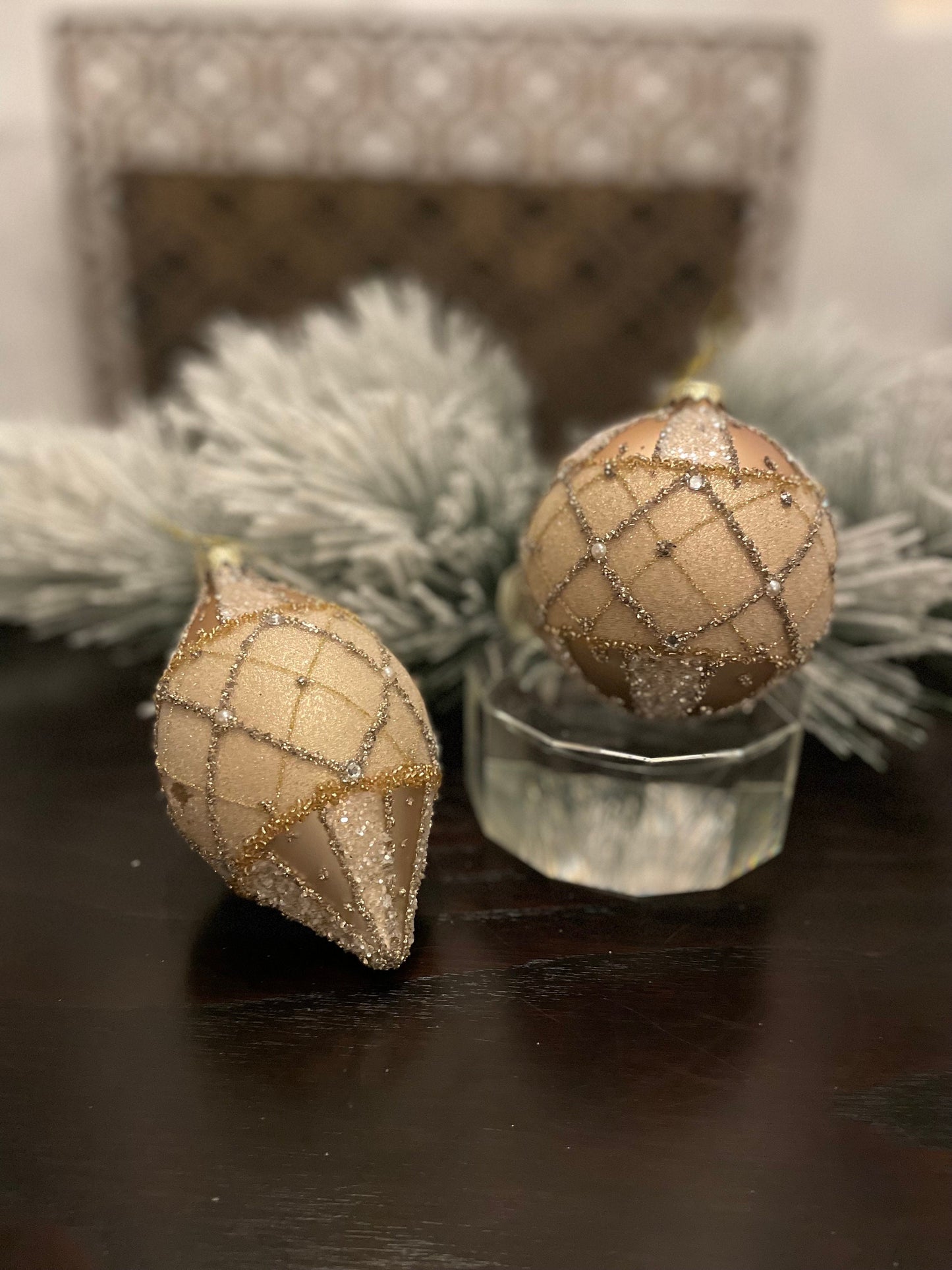 Set of 2. 4-6” glass jewel edge ball and finial ornaments. Ivory and gold.