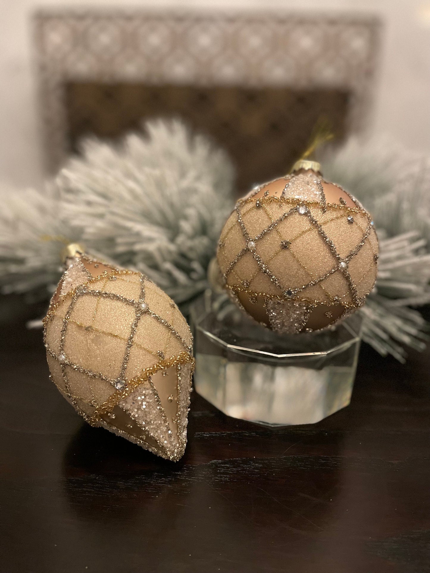 Set of 2. 4-6” glass jewel edge ball and finial ornaments. Ivory and gold.