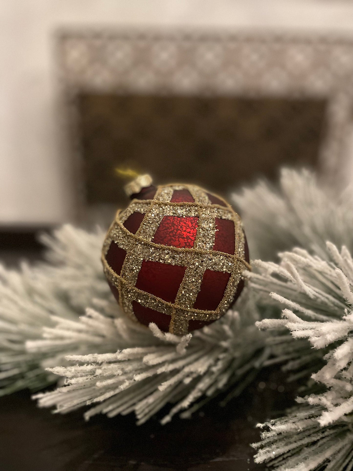 Set of 2. 4” glass gilded cranberry ball ornament.