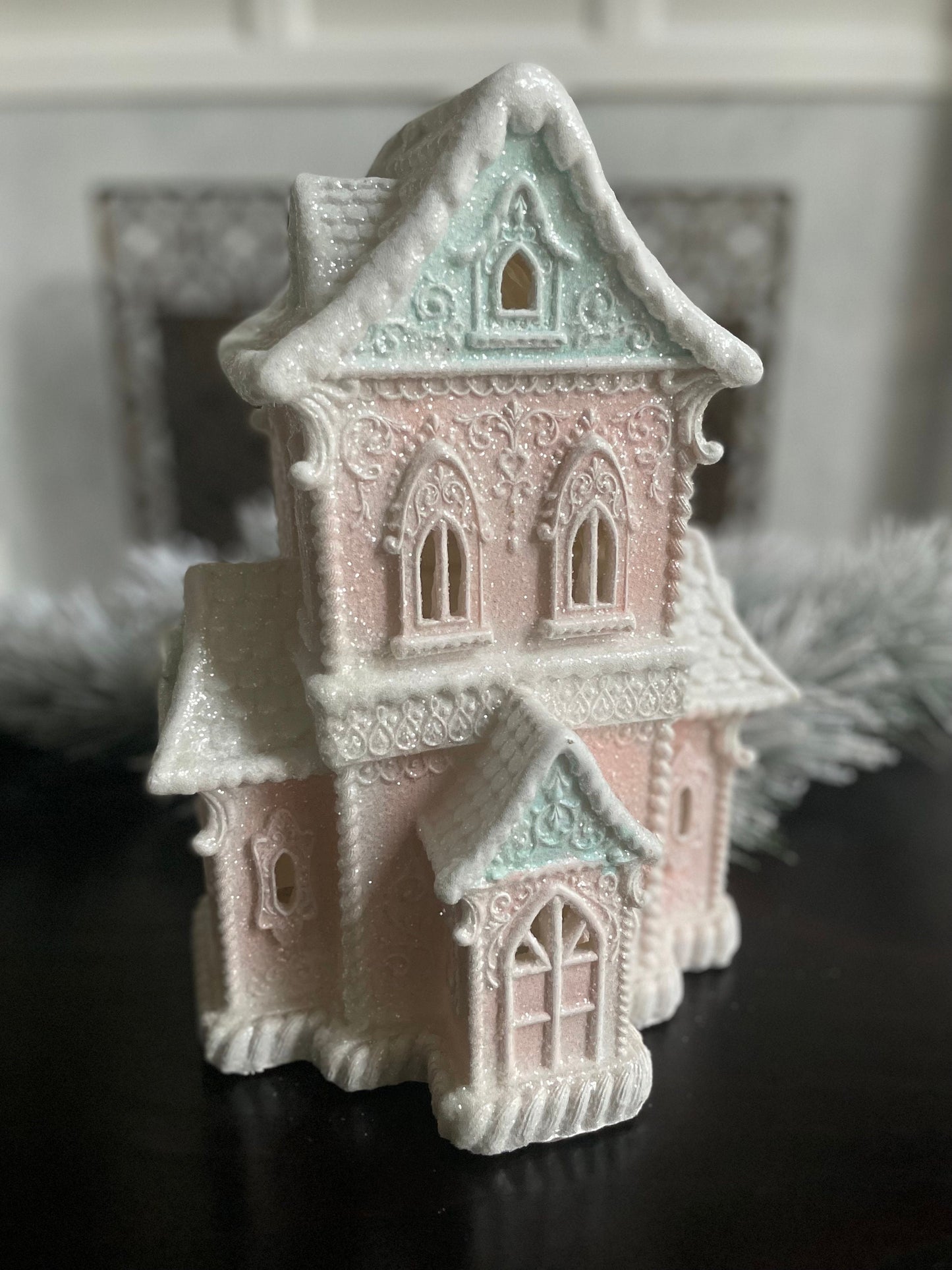 14”H x 9.5”W x 8” D. Gingerbread lighted house. Pink and blue.