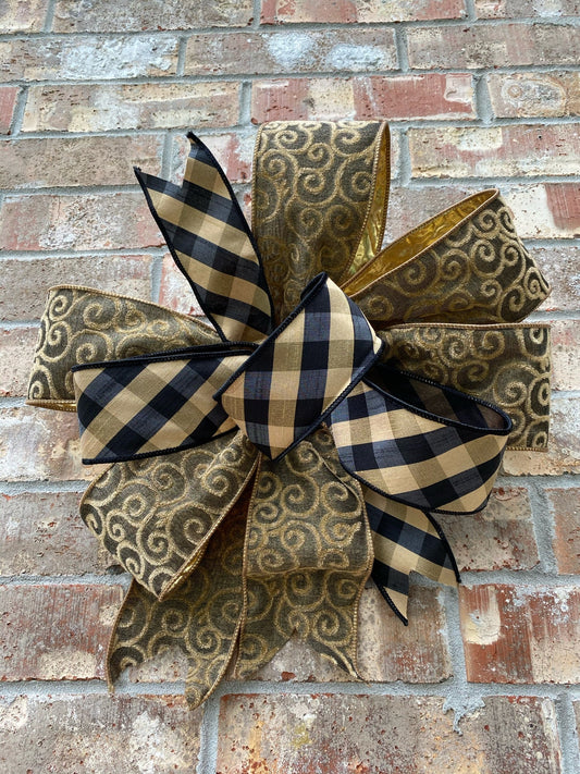 15” approx. diameter Bow antique gold and black. The bow has 8 loops.