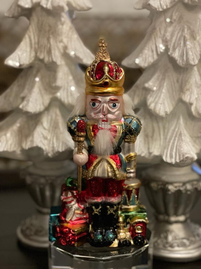 8.5" Nutcracker with presents ornament. With crown or hat. Glass. Raz. Only one nutcracker.