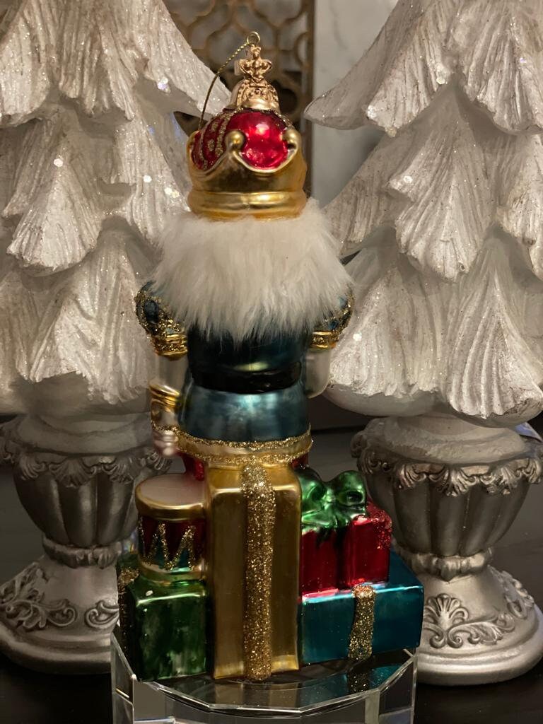 8.5" Nutcracker with presents ornament. With crown or hat. Glass. Raz. Only one nutcracker.
