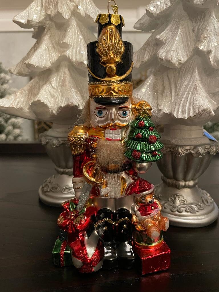 8.5" Nutcracker with presents ornament. With crown or hat. Glass. Raz. Only one nutcracker.