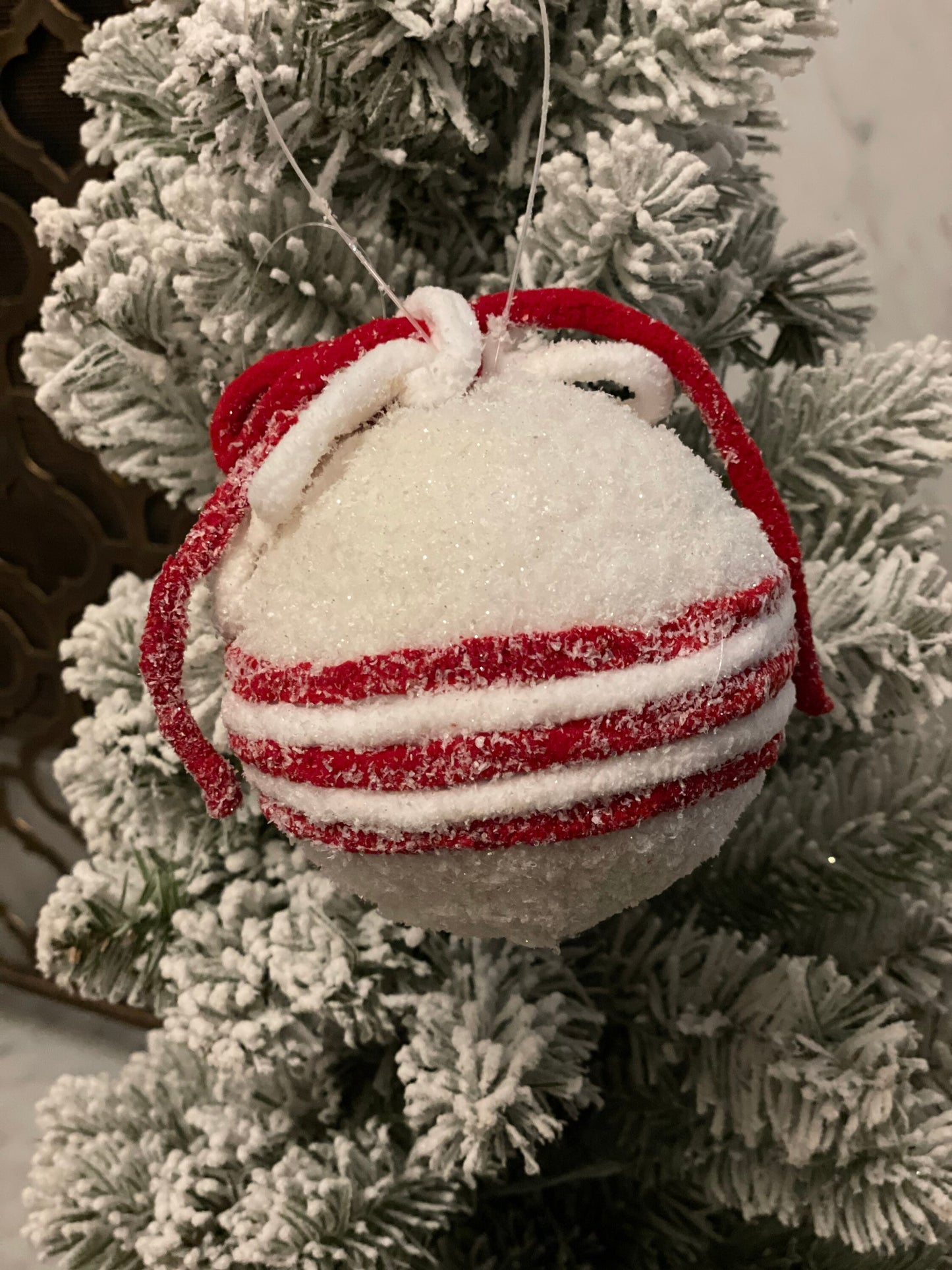 4.5” frosted ball ornament. candy cane ornament. Red and white frosted ornament.