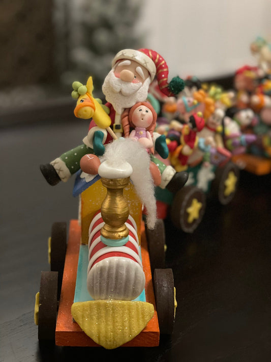 Train full of toys with Santa. Polymer clay. Handmade. Christmas.
