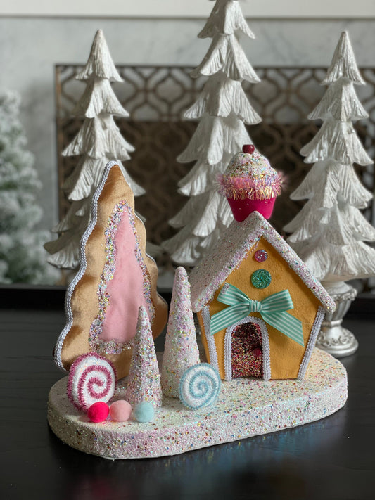 14”Hx 16”W. Candy house with cupcake, candy and trees. One Candy house.