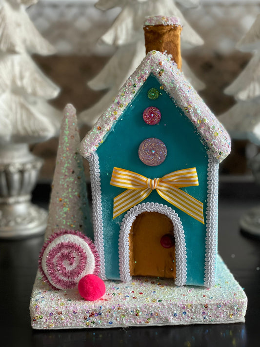 11” Gingerbread house blue with candy and tree. One Candy house.