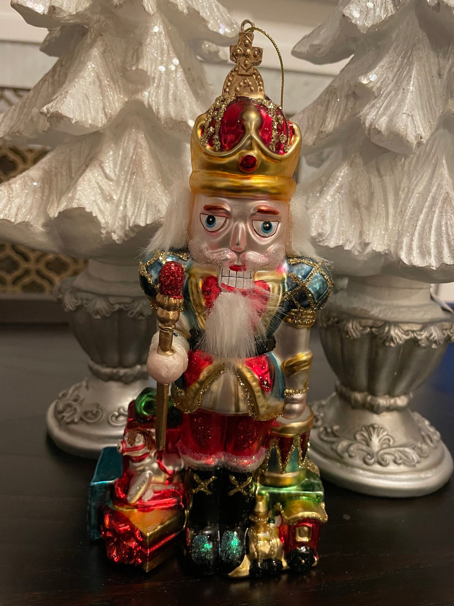 8.5" Nutcracker with presents ornament. With crown or hat. Glass. Raz. Only one nutcracker.