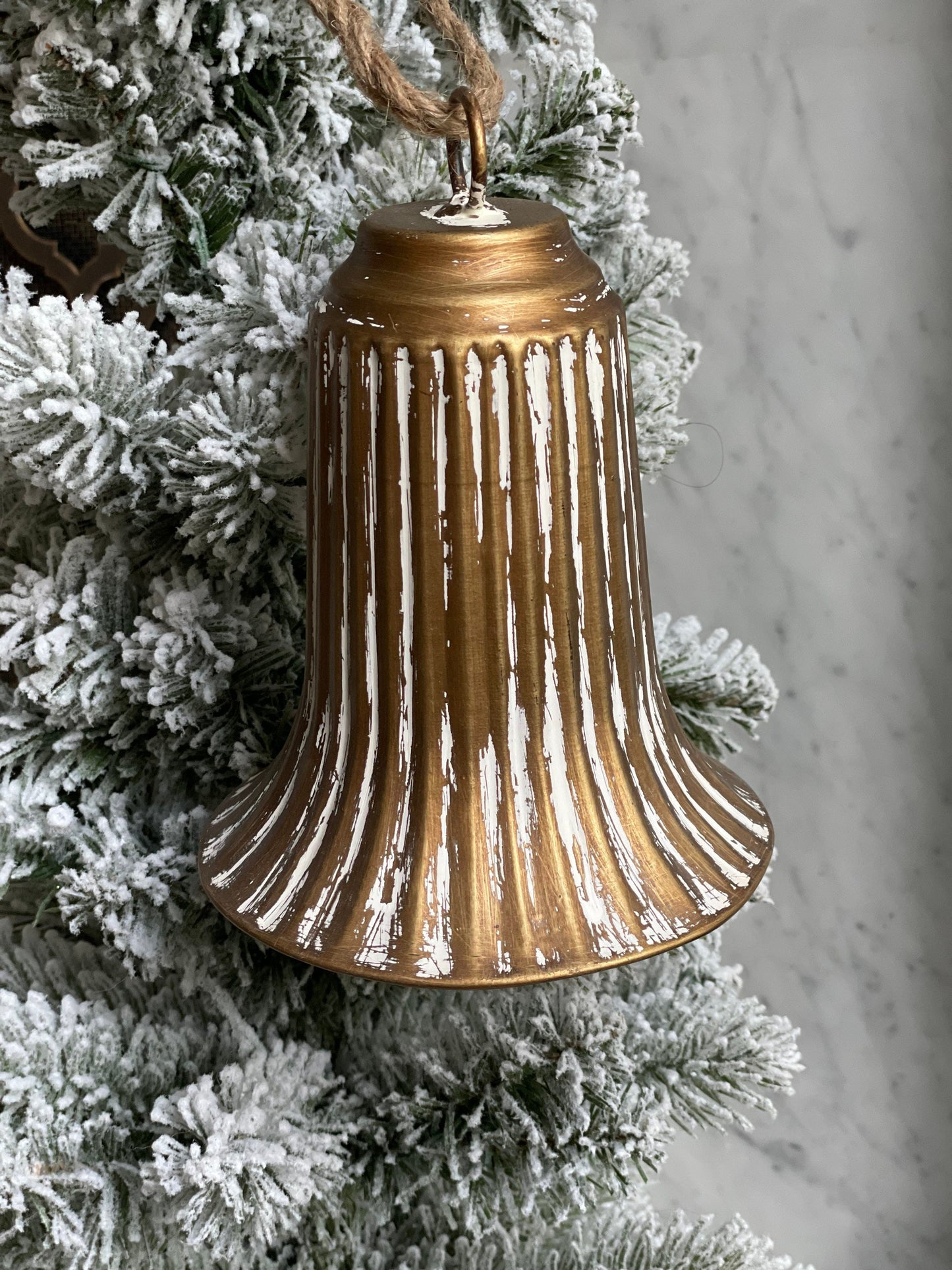 7.5” bell ornament. Iron.