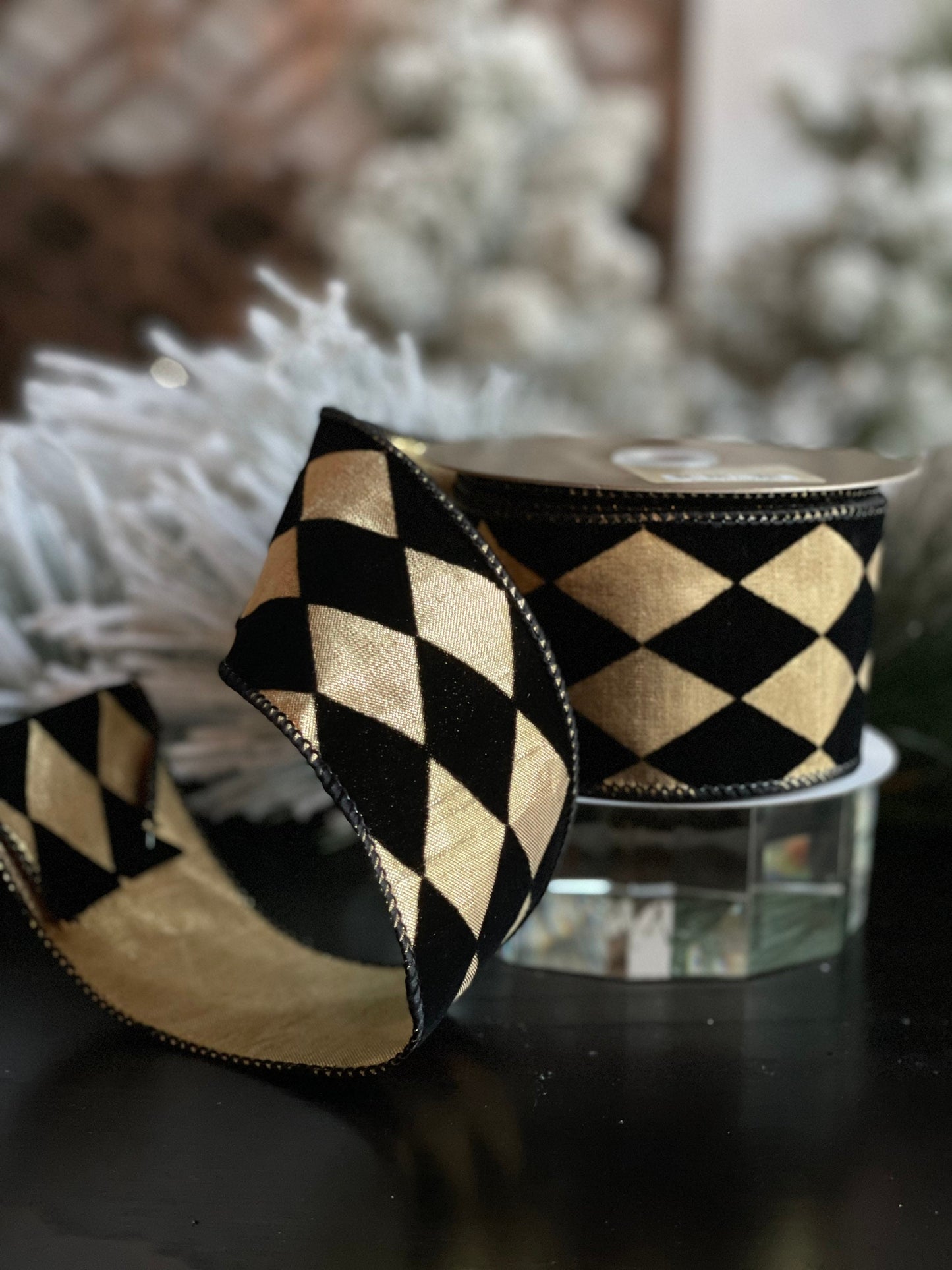 2.5"X 10 yds. Diamond ribbon. Black velvet diamonds. Black and gold. Wired.