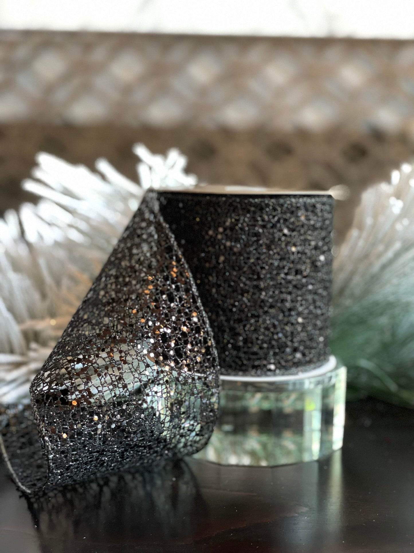4"x10 yds. Black glitter mesh ribbon. Wired.