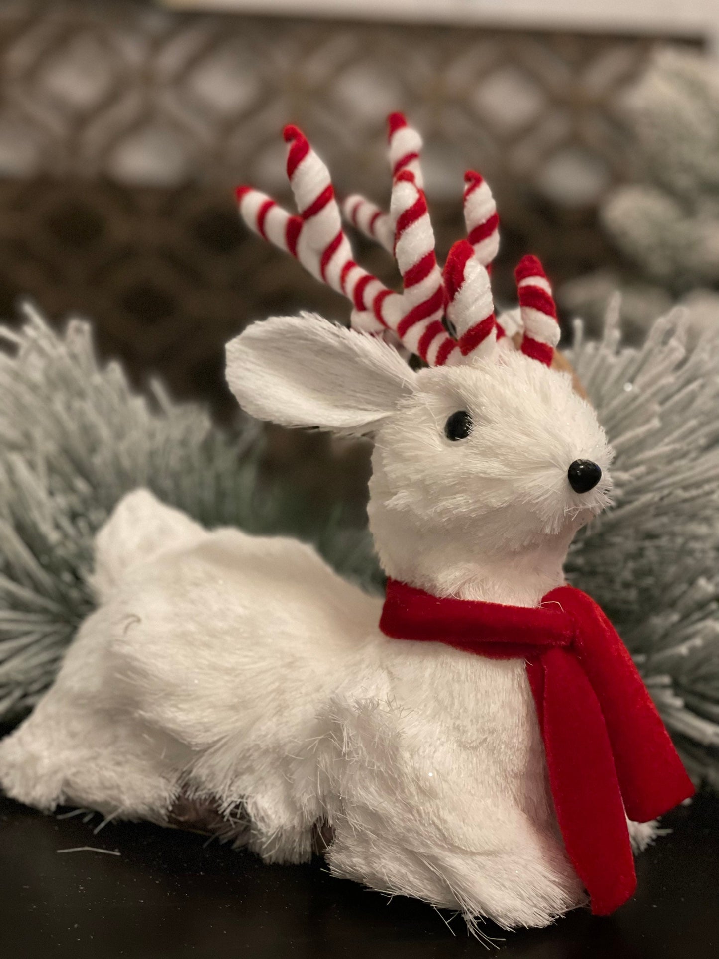10.75 inch Deer sitting tabletop ornament. Christmas. White and red.