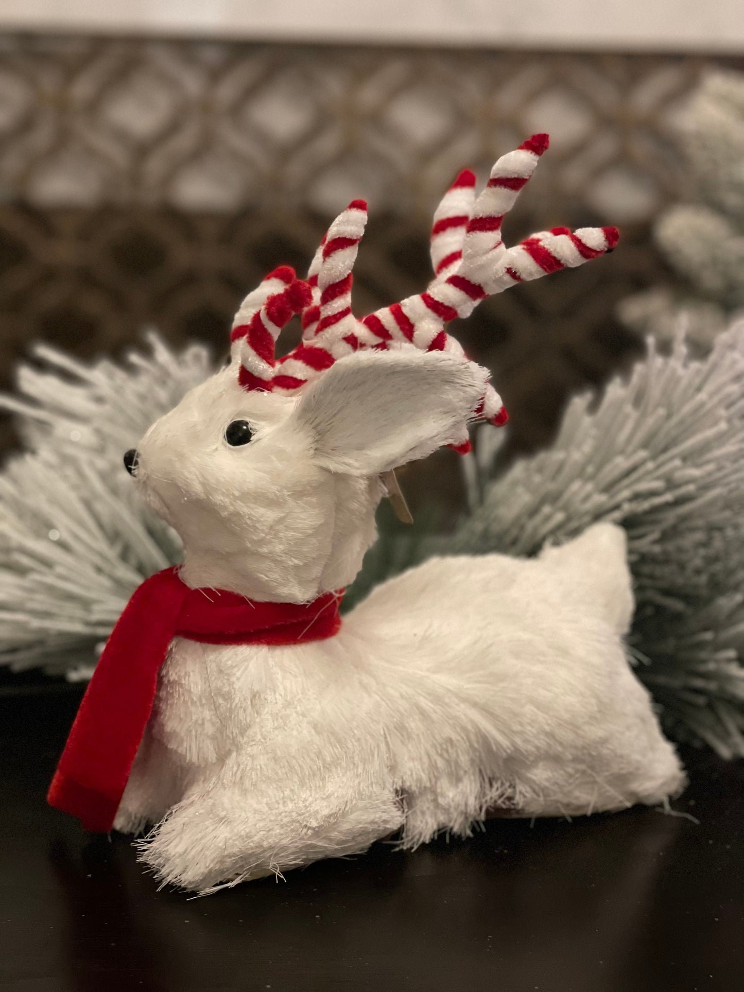 10.75 inch Deer sitting tabletop ornament. Christmas. White and red.