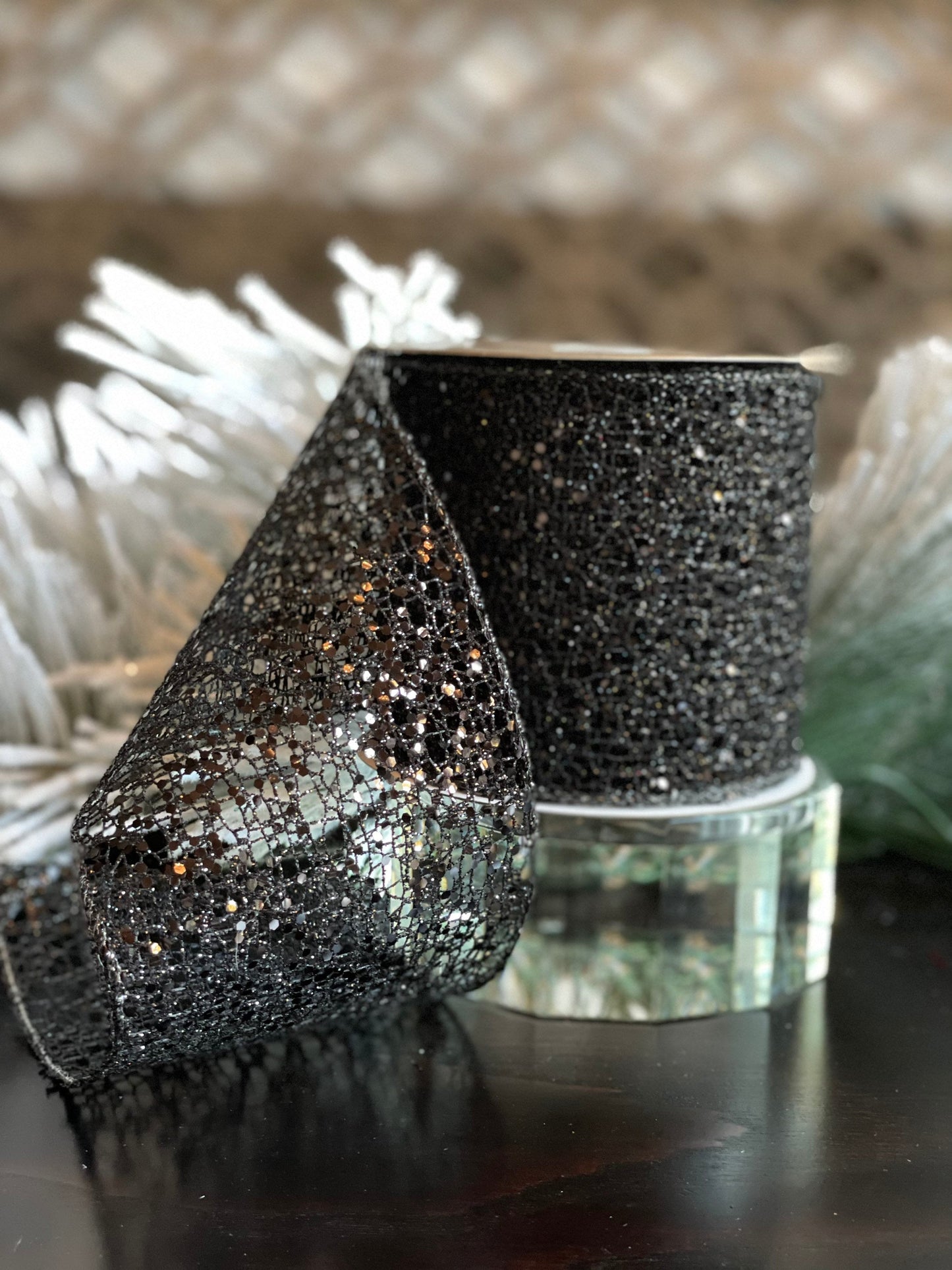 4"x10 yds. Black glitter mesh ribbon. Wired.