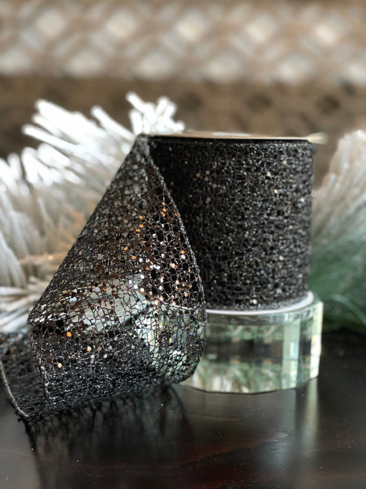 4"x10 yds. Black glitter mesh ribbon. Wired.