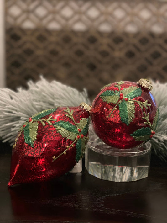 7" Holly patterned glass ornament.