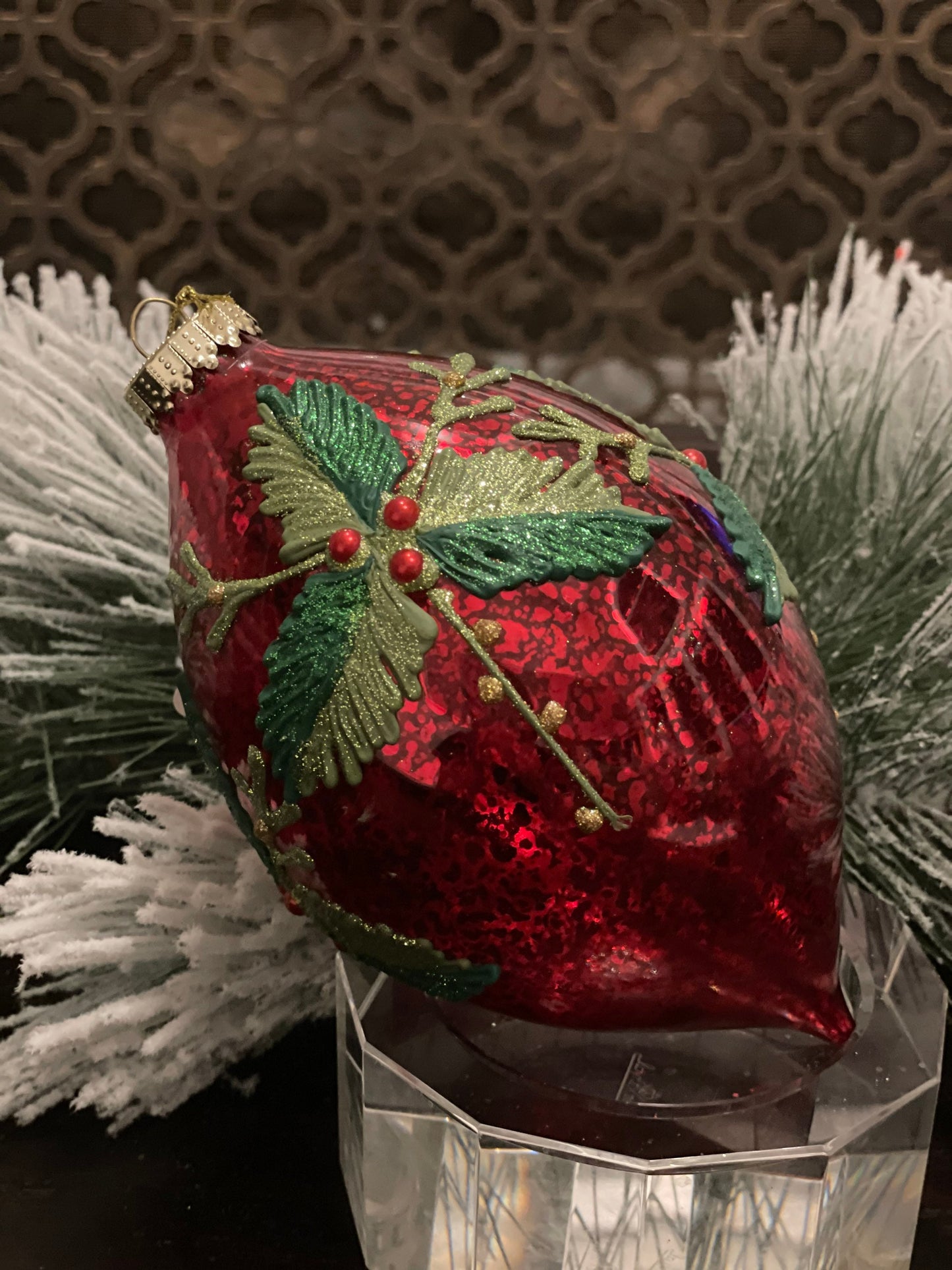 7" Holly patterned glass ornament.