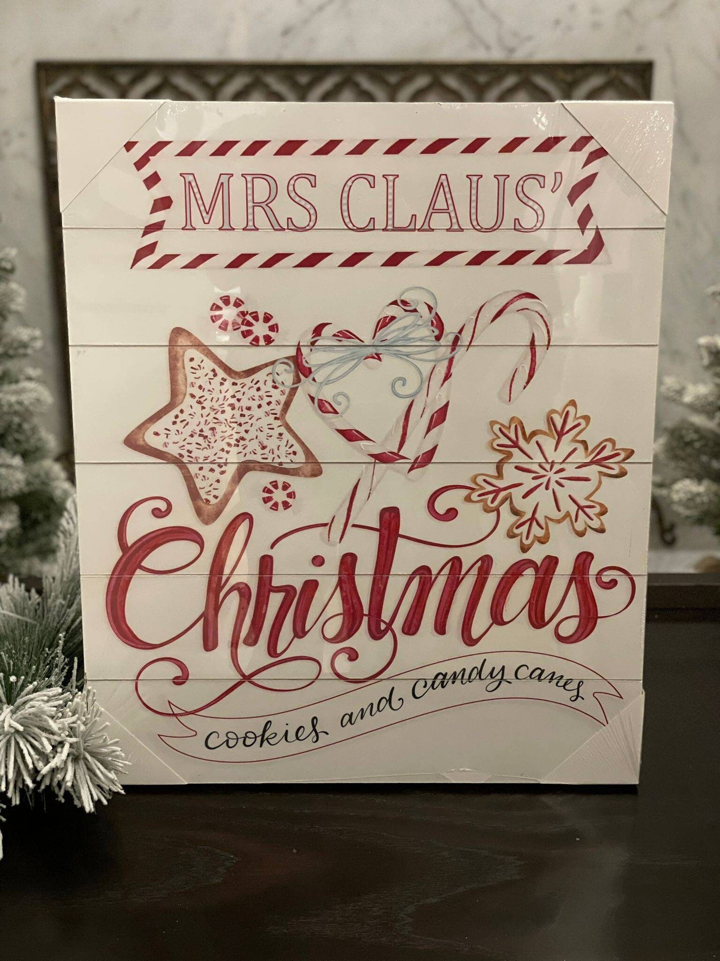 23.75" Mrs. Claus cookies wood looking wall art.